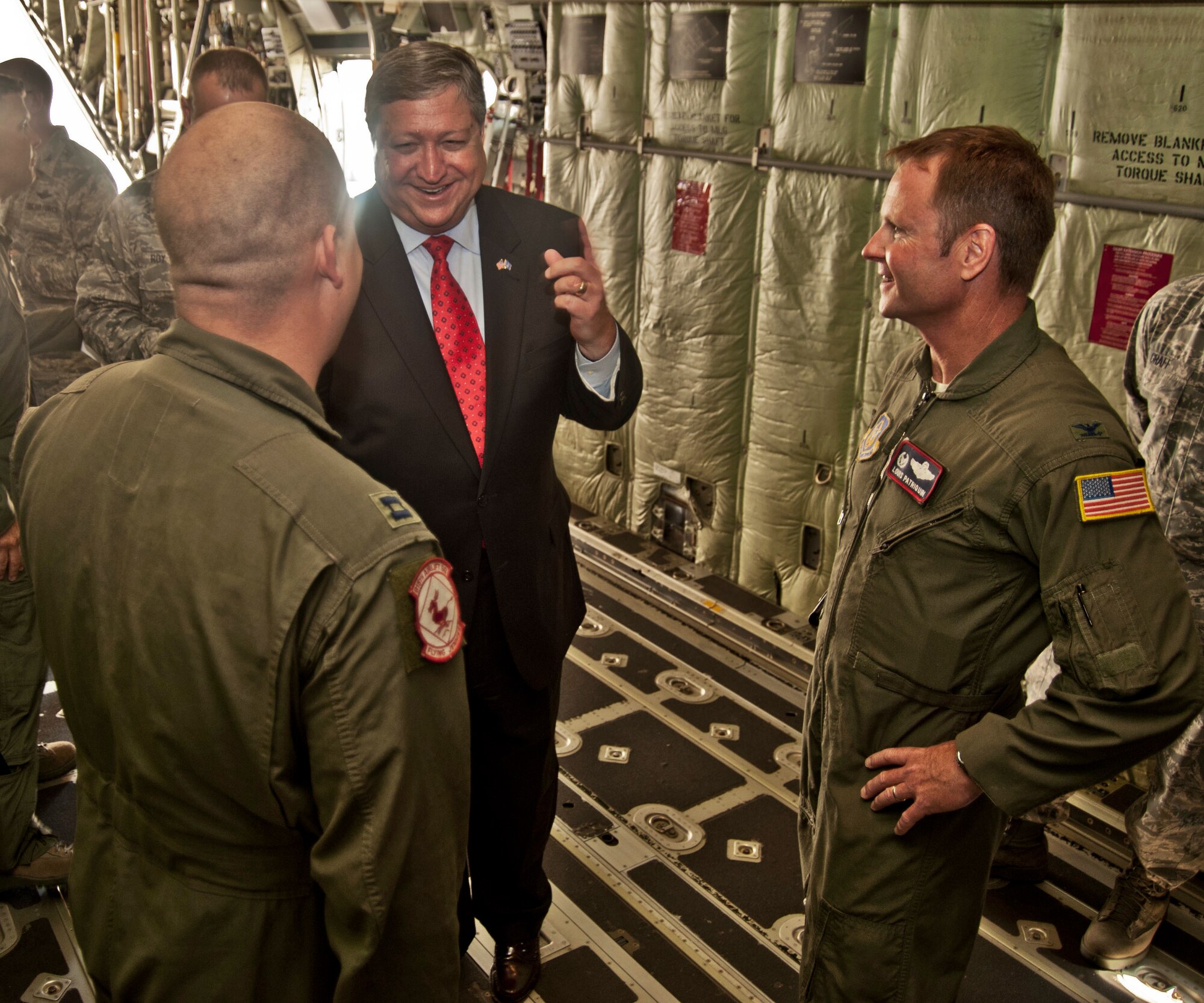 Secretary of the Air Force Michael Donley speaks with Col. Louis Patriquin, 403rd Operations Group commander, and Capt. William Miller, an 815th Airlift Squadron pilot.  Secretary Donley and Chief Master Sgt. of the Air Force James Roy visited Keesler Air Force Base, Miss., May 19, 2011. During their visit, they had the opportunity to meet 403rd Wing members and tour a WC-130-J aircraft. (U.S. Air Force photo/Maj. Heather Newcomb)
