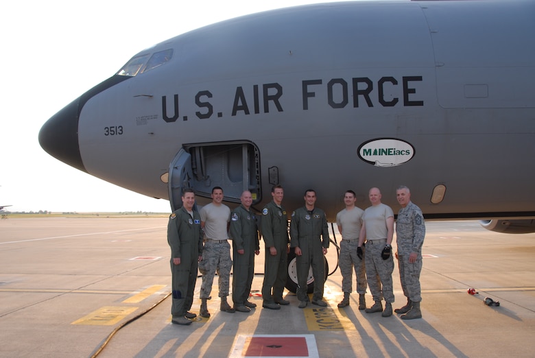 Members of the 313th Air Expeditionary Wing gather for a photo following the 1,000th sortie flown in support of Operation Unified Protector, a NATO-led mission enhancing a no fly zone established by United Nations Security Council Resolution 1973 over Libya.  (U.S. Air Force photo by Capt. Dicie
Hritz/Released)
