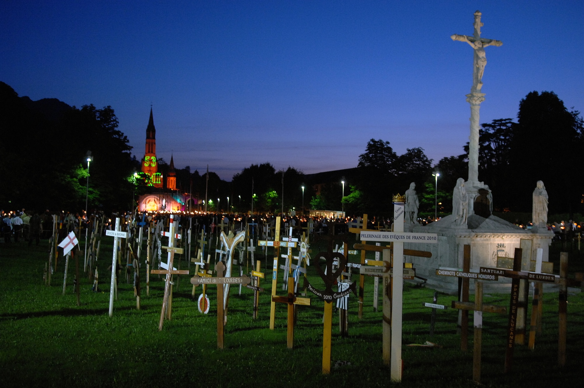 The evening of the Marian Procession has its passage marked by crosses that lead to the Rosary Esplanade during the International Military Pilgrimage. The Pilgrimage originated in Lourdes, France, in 1944 when several multi-national military units came together to share a Mass in the Rosary Basilica. This marks the 53rd year of this event that has grown to more than 34 nations participating. (U.S. Air Force photo by Chief Master Sgt. David W. Richards)