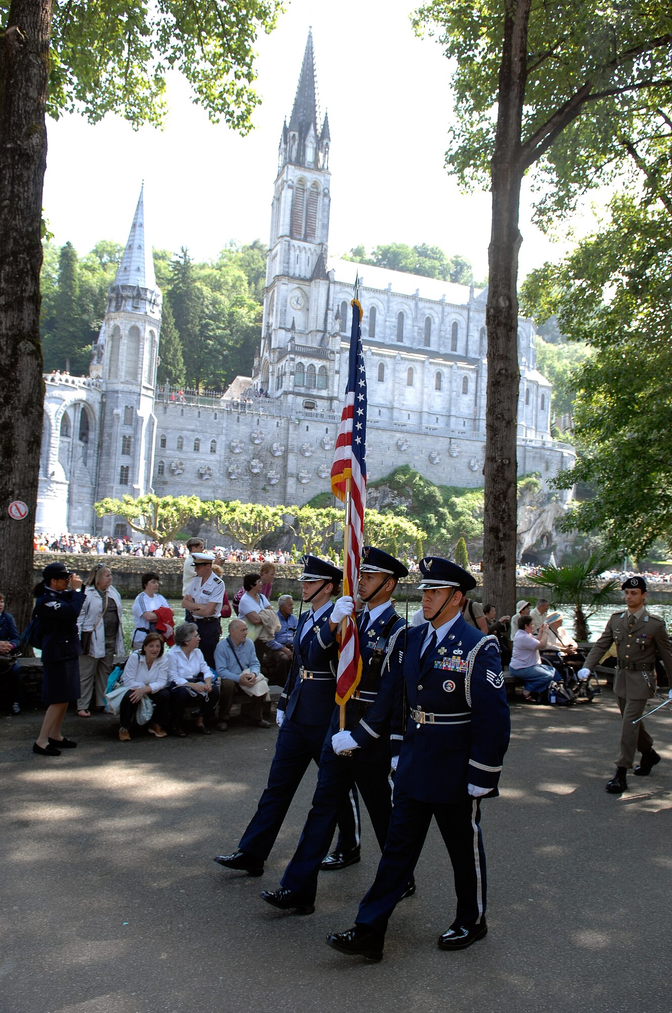 The Honor Guard from Ramstein Air Base marches in the procession of the Blessed Sacrament and Benediction during the International Military Pilgrimage. The Pilgrimage originated in Lourdes, France, in 1944 when several multi-national military units came together to share a Mass in the Rosary Basilica. This marks the 53rd year of this event that has grown to more than 34 nations participating. (U.S. Air Force photo by Chief Master Sgt. David W. Richards)