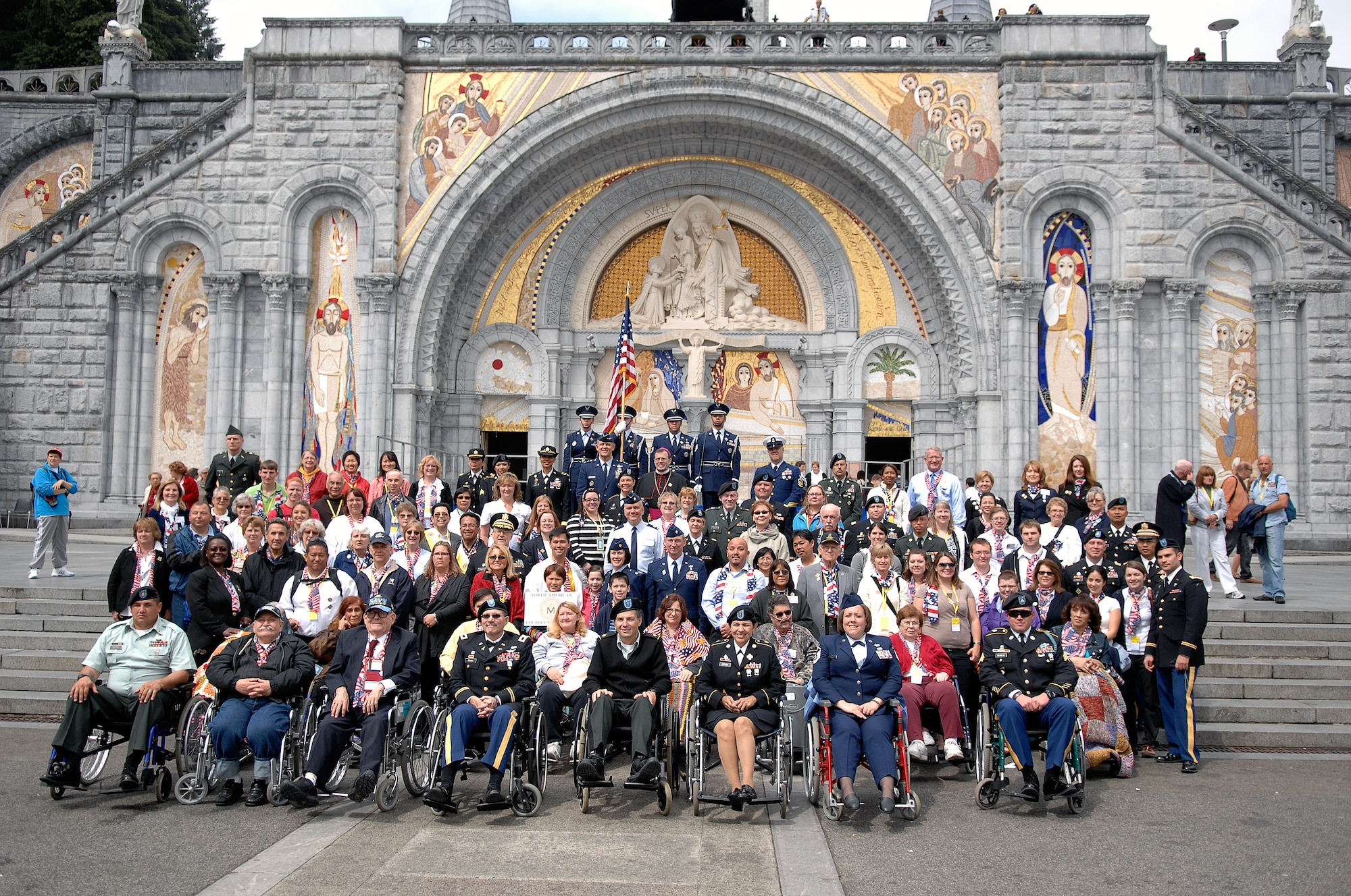 The United States delegation gets together for a group photo after completing the Stations of the Cross during the International Military Pilgrimage. The Pilgrimage originated in Lourdes, France, in 1944 when several multi-national military units came together to share a Mass in the Rosary Basilica. This marks the 53rd year of this event that has grown to more than 34 nations participating. (U.S. Air Force photo by Chief Master Sgt. David W. Richards)