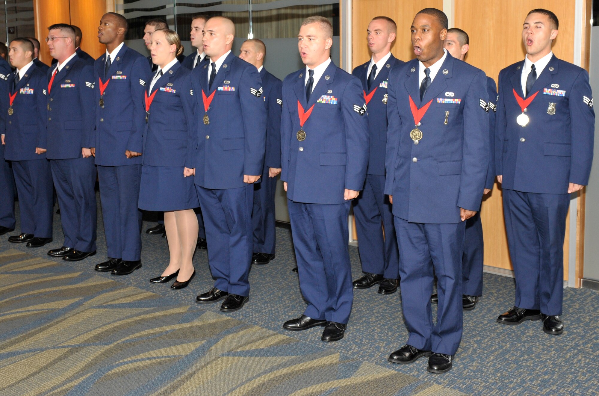 Airman Leadership School's graduating class 11-4 sings the Air Force Song at the Heritage Club May 19 as their graduation ceremony commences. (U.S. Air Force photo by Jonathan Gibson)

