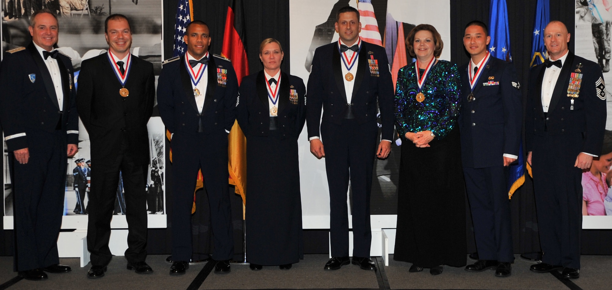 The annual awards winner pose for a photo with Gen. Mark A. Welsh III, U.S. Air Forces in Europe commander (far left), and Chief Master Sgt. Dave Williamson, USAFE command chief master sergeant (far right). The winners pictured are: Eren Ersoy, 39th Air Base Wing, Incirlik Air Base, Turkey; Capt. Gilbert Wyche, Master Sgt. Kathleen Ross and Tech. Sgt. Dustin Goodwin, 48th Fighter Wing, RAF Lakenheath, United Kingdom; and Theresa Vannier, 3rd Air Force and Senior Airman Johnny Nguyen, 86th Airlift Wing, Ramstein Air Base, Germany.  (U.S. Air Force photo by Senior Airman Caleb Pierce/Released)