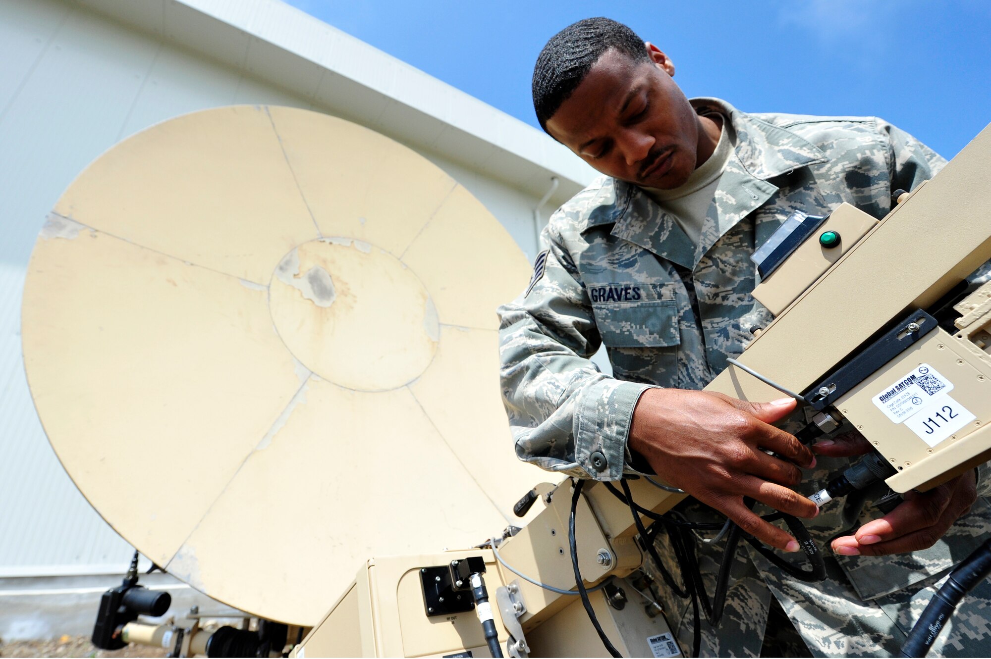 Staff Sgt. Justin Graves, 621st Contingency Response Wing radio frequency transmission systems technician performs maintenance communication equipment at Burgas Airport, Bulgaria May 17.  Four KC-135 Stratotankers and approximately 80 personnel are scheduled to operate from the airport through the end of May.  The aircraft are temporarily deployed here from another base in the region that is currently closed for routine runway repairs.  (U.S. Air Force photo by Master Sgt. Laura K. Deckman/released)