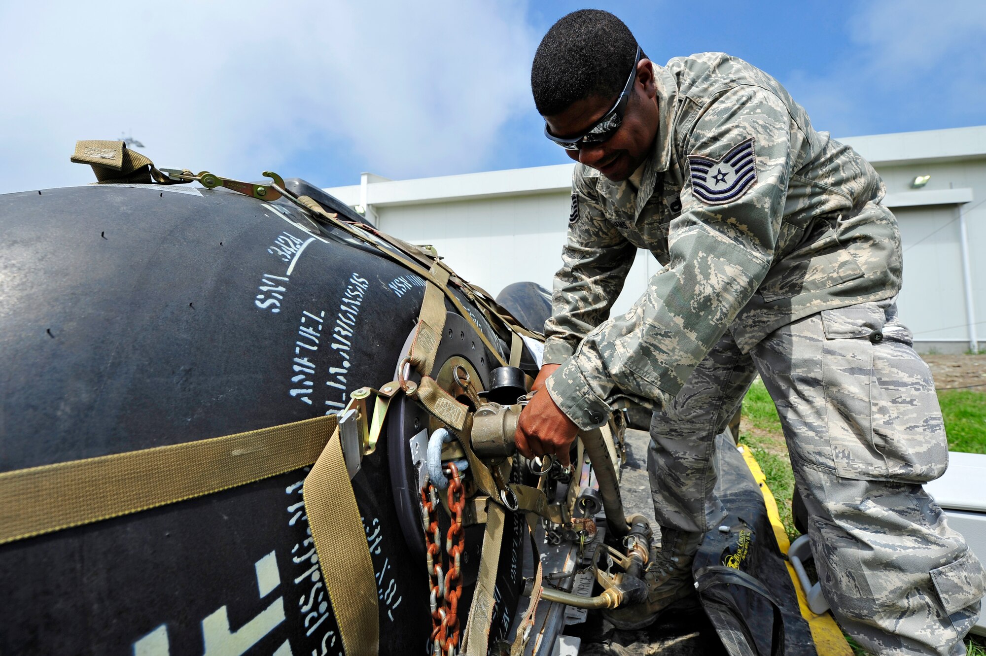 Tech. Sgt. Charles Williams, 621st Contingency Response Wing aerospace ground equipment technician performs maintenance on a fuel bladder at Burgas Airport, Bulgaria May 17.  Four KC-135 Stratotankers and approximately 80 personnel are scheduled to operate from the airport through the end of May.  The aircraft are temporarily deployed here from another base in the region that is currently closed for routine runway repairs.  (U.S. Air Force photo by Master Sgt. Laura K. Deckman/released)