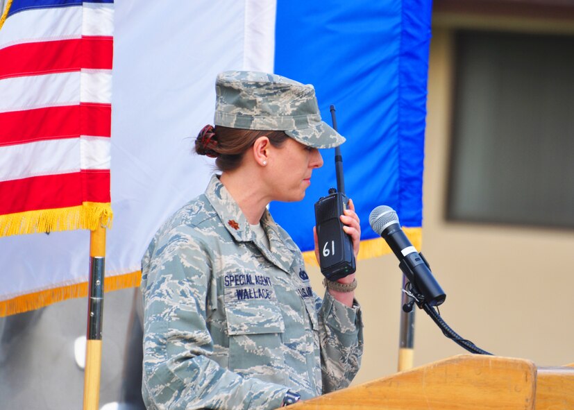 Maj. Traci Wallace, 5th Field Investigations Squadron, was the narrator of the ceremonial retreat held here May 19, to honor Master Sgt. Tara Brown from the Office of Special Investigations and Senior Airman Nicholas Alden from security forces. Osan members recently celebrated National Police Week with a weapons and vehicle display and free fingerprinting at the base exchange; a 5k fun-run; and a ceremonial retiring of two Airmen who were killed in the line of duty. (U.S. Air Force photo/Staff Sgt. Chad Thompson)