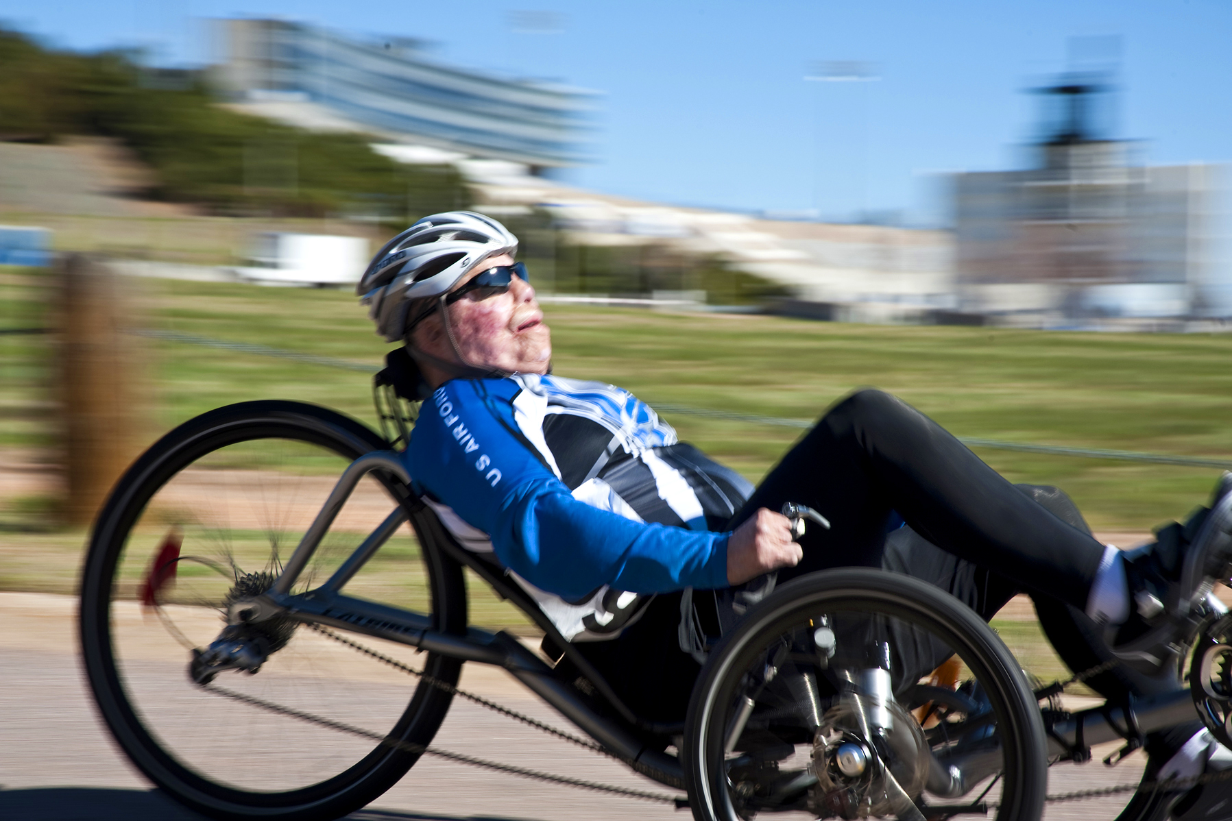 Air Force Tech. Sgt. Israel Deltoro speeds by on a recumbent bike