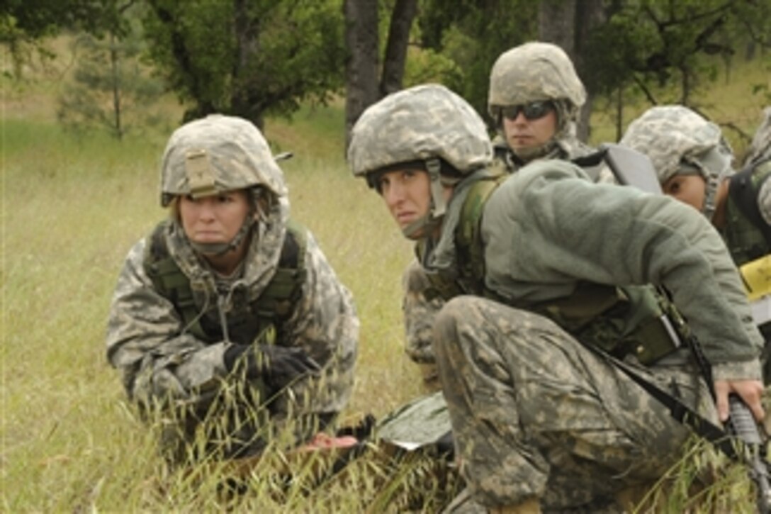 U.S. Army medics attend to a simulated casualty during a medical evacuation in support of Global Medic 2011 and Warrior 91 11-01 at Fort Hunter Liggett, Calif., on May 17, 2011.  Global Medic is a joint field training exercise for theater aeromedical evacuation system and ground medical components.  The exercise replicates all aspects of combat medical service support.  