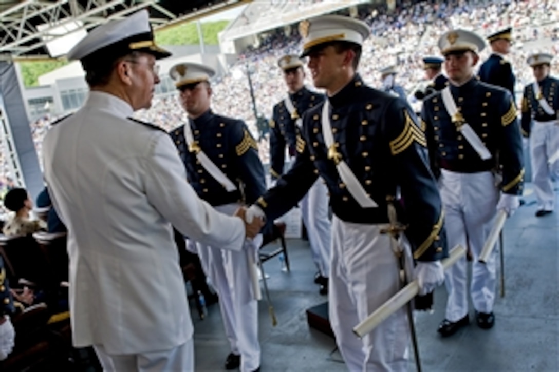 Chairman of the Joint Chiefs of Staff Adm. Mike Mullen, U.S. Navy, congratulates cadets during commencement ceremonies at the U.S. Military Academy at West Point, N.Y., on May 21, 2011.  