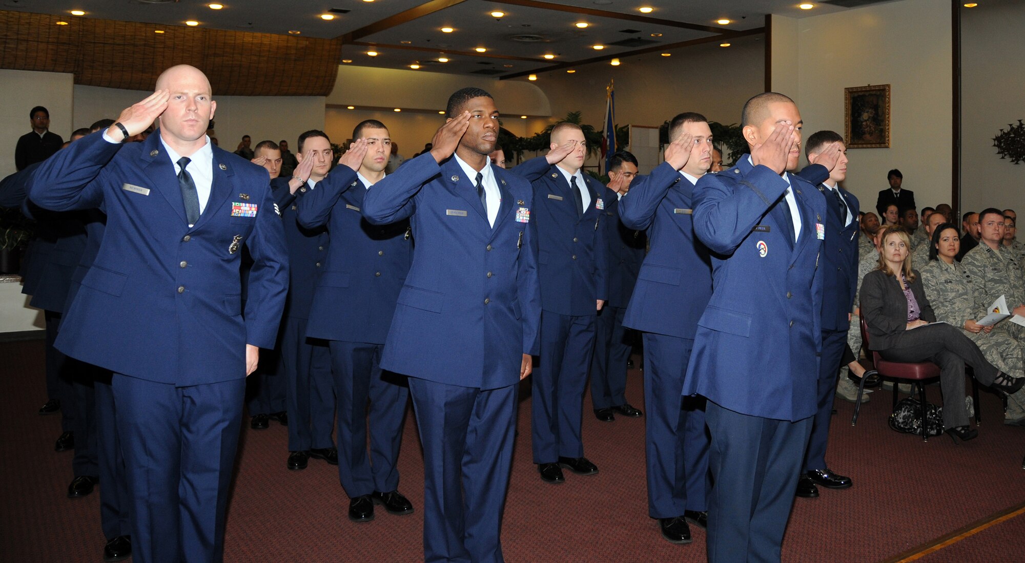 YOKOTA AIR BASE, Japan- 374th Security Forces Squadron members render their fist salute to Major Steven Lovett, 374th SFS commander, during a change of command ceremony at Yokota Air Base, Japan, May 24, 2011. (U.S. Air Force Photo/Airman 1st Class Katrina R. Menchaca)