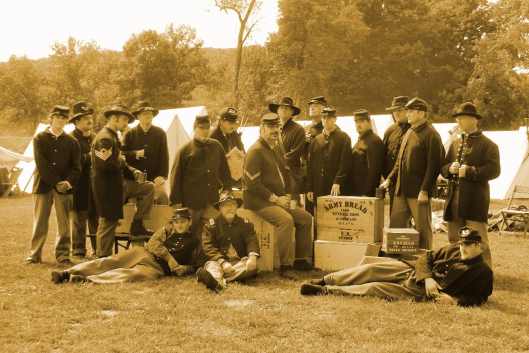 Members of the 17th Missouri Infantry pose for a photo during a re-enactment at Jefferson Barracks in St. Louis. Sergeant Prather is seventh from the right in a wide-brimmed hat. (Courtesy photo)