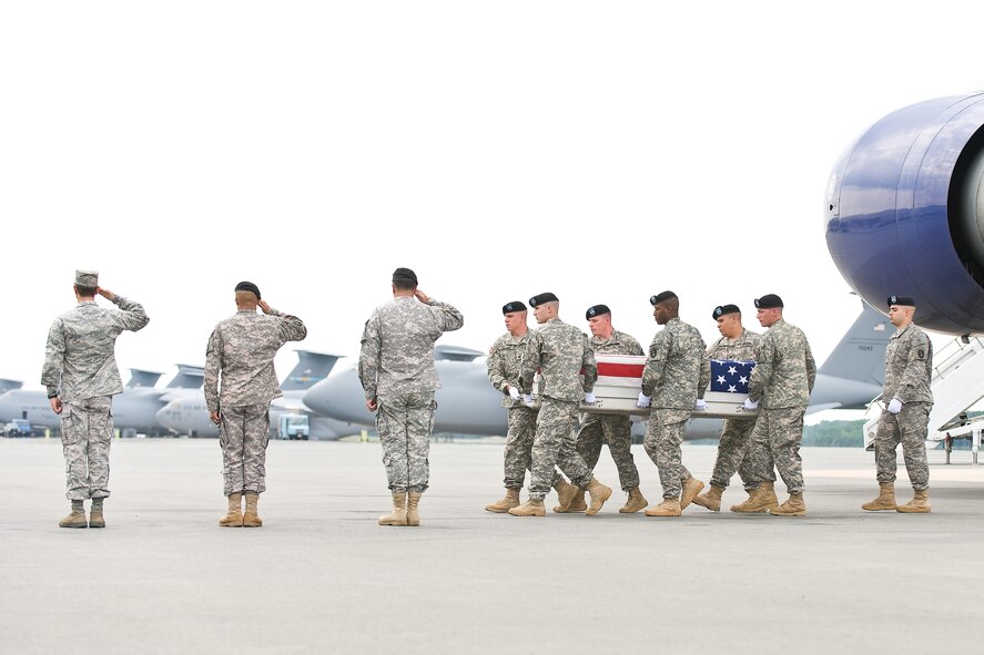 A U.S. Army carry team transfers the remains of Army Pfc. Ramon Mora Jr., of Ontario, Calif., at Dover Air Force Base, Del., May 24, 2011. Mora was assigned to the 1st Battalion, 63rd Armor, 2nd Brigade Combat Team, 1st Infantry Division, Fort Riley, Kan. (U.S. Air Force photo/Roland Balik)