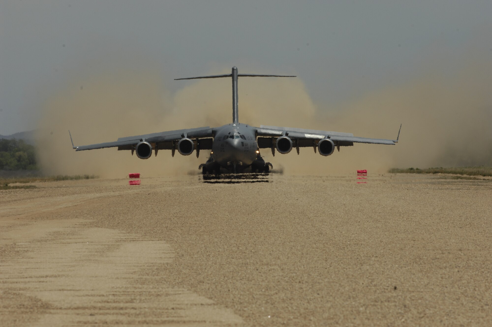A C-17 Globemaster III aircraft assigned to the 452nd Air Mobility Wing, March Air Reserve Base, Calif., lands at Schoonover Field, Fort Hunter Liggett, Calif., on May 14, 2011, in support of exercise Global Medic 2011. Global Medic is a joint field training exercise for theater aeromedical evacuation system and ground medical components designed to replicate all aspects of combat medical service support. (U.S. Air Force Photo/Staff Sgt. Donald R. Allen)