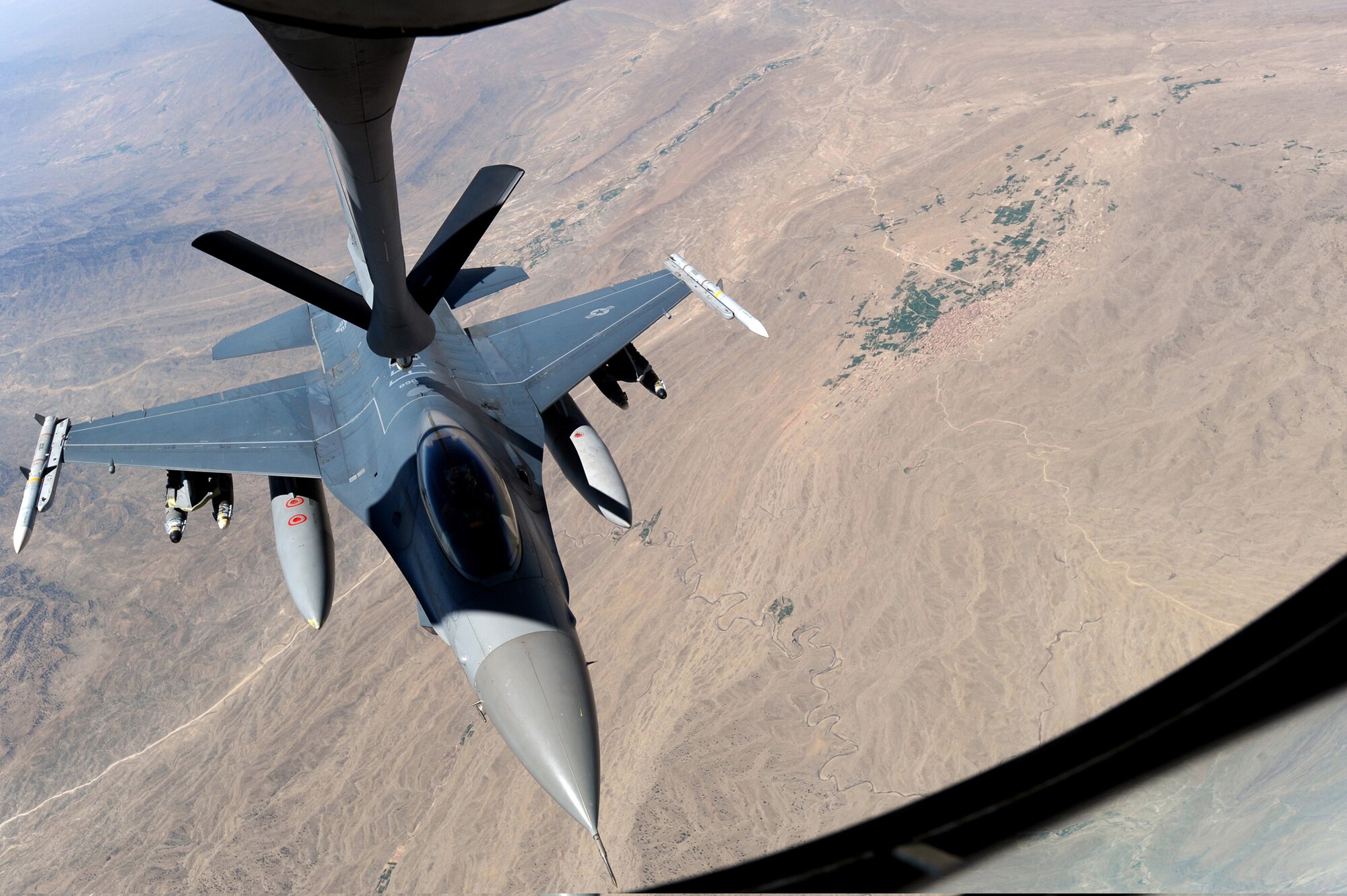An F-16 Fighting Falcon receives fuel from a KC-135 Stratotanker May 8, 2011, above Afghanistan. (U.S. Air Force photo/Master Sgt. William Greer)
