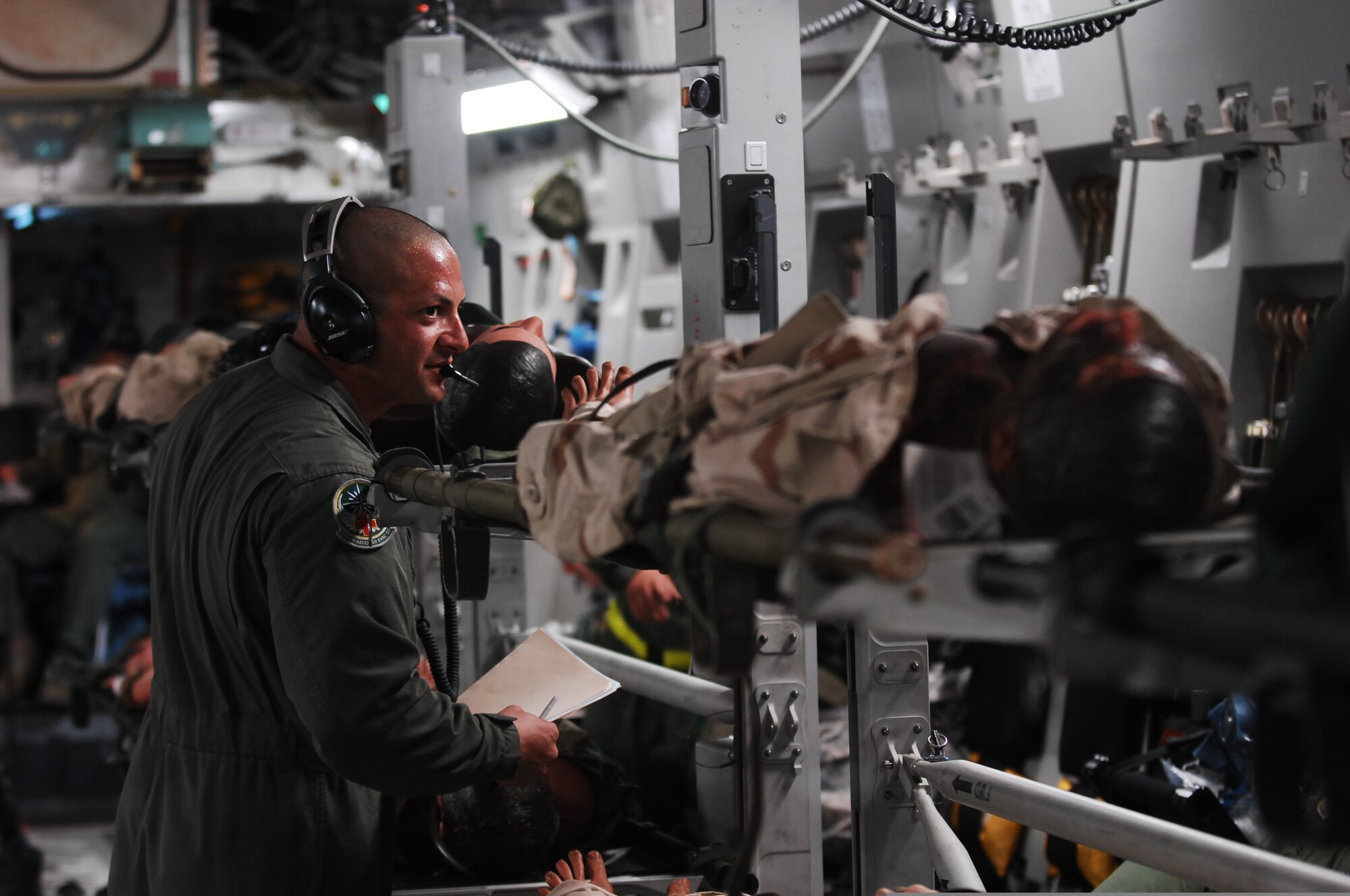 Staff Sgt. Martin Duran, an aeromedical technician from the 446th Aeromedical Evacuation Squadron at Joint Base Lewis-McChord, Wash., checks the status of a simulated casualty during an aeromedical evacuation mission aboard a C-17 Globemaster III aircraft at Schoonover Field, Fort Hunter Liggett, Calif., on May 21, 2011, in support of Global Medic 2011 and Warrior 91 11-01. Global Medic is a joint field training exercise for theater aeromedical evacuation system and ground medical components designed to replicate all aspects of combat medical service support. (U.S. Air Force Photo/Staff Sgt. Donald R. Allen)