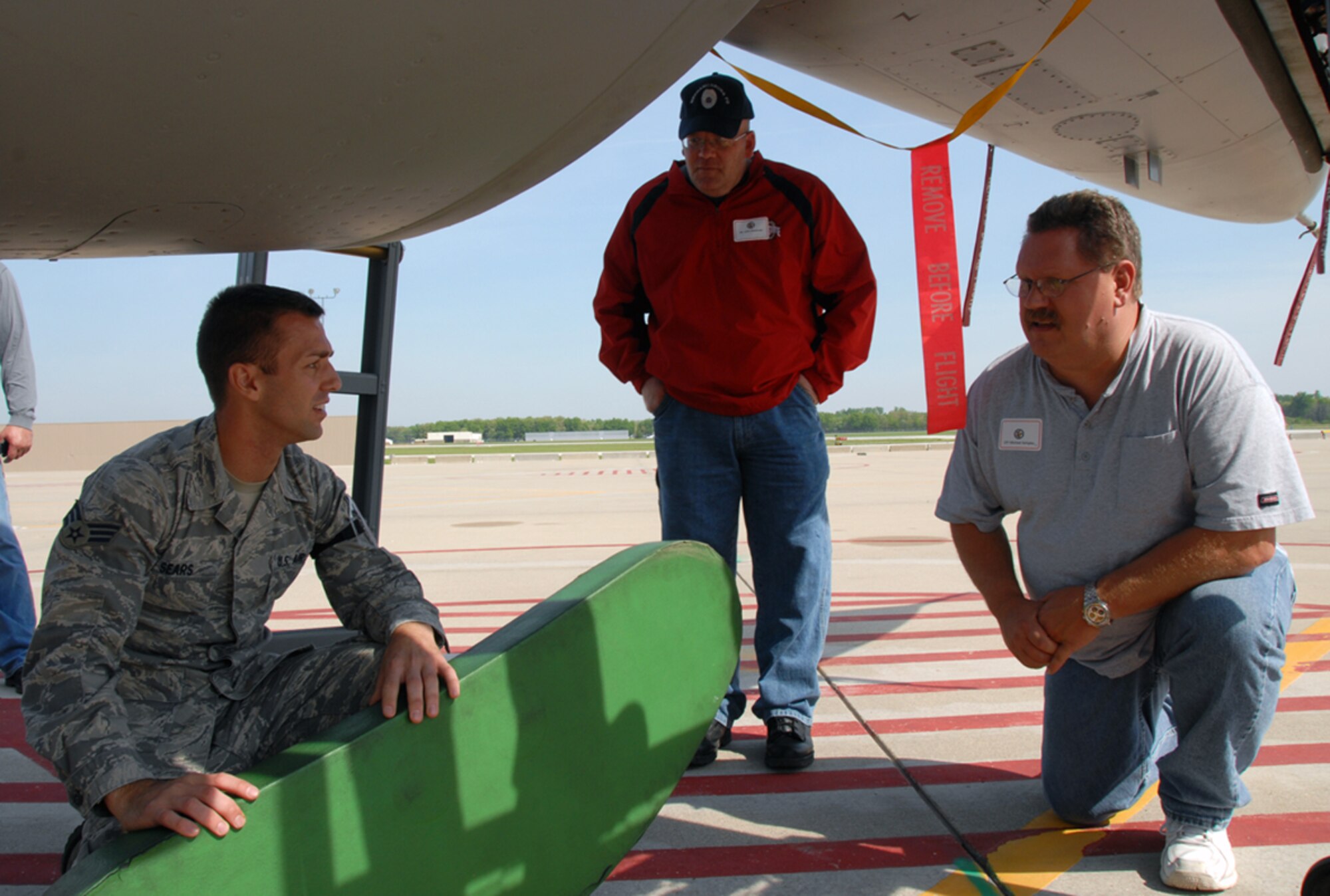 Senior Airman Benjamin Sears shows two employers various aspects of the F-16 Fighting Falcon May 21, 2011.  Members of the Ohio Air National Guard’s 180th Fighter Wing and the Ohio Army National Guard’s Camp Perry Joint Training Center hosted a joint employer event sponsored by the Ohio Adjutant General, welcoming 20 employers of Ohio Guardsmen.  Airman Sears is a maintainer with the 180th Aircraft Maintenance Squadron at Toledo Express Airport, Ohio.  (U.S. Air Force photo)