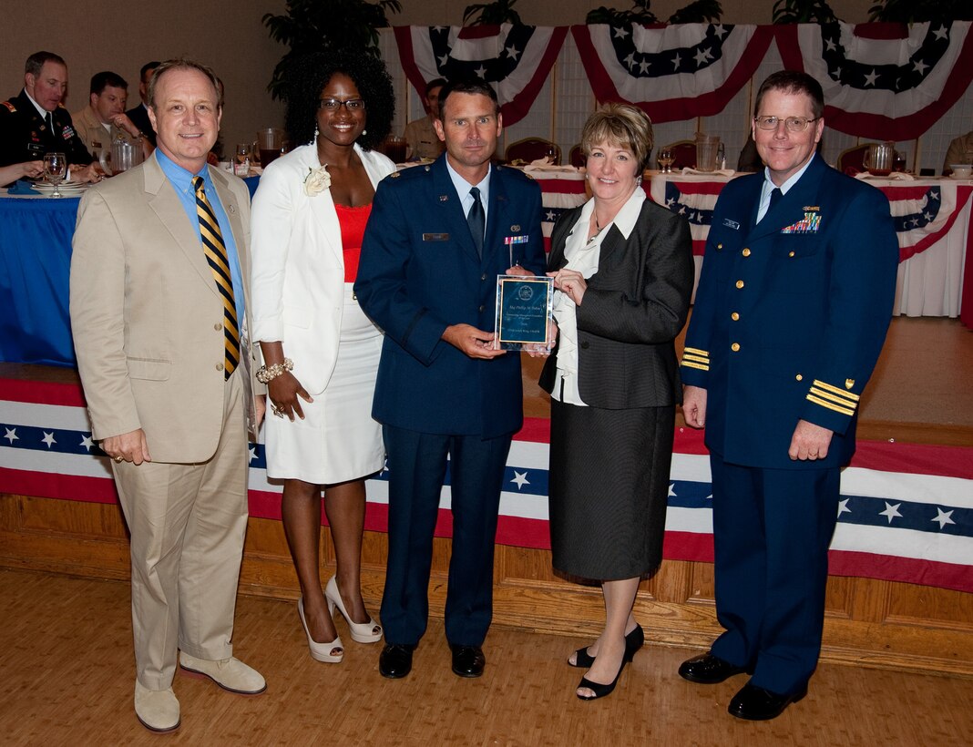 Three members from the 315th Maintenance Group were recently selected as the Federal Employee Association’s Employees of the Year. (center) Maj. Phil Tobin 315th AMXS, recieves his award. (Courtesy photo by Joe Bullinger)