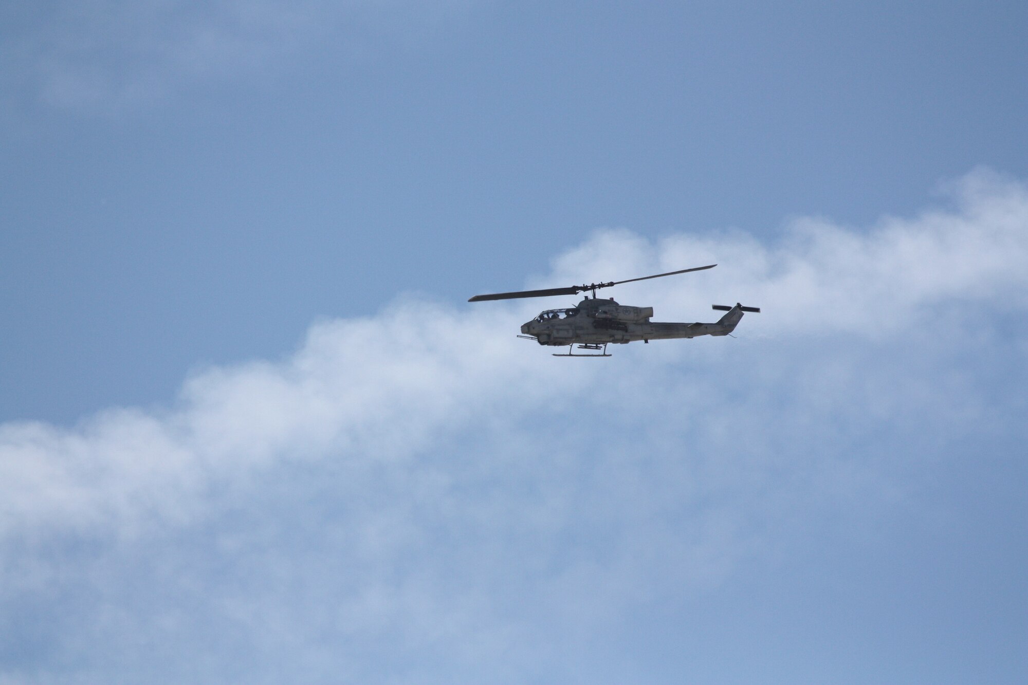 A Marine Corps AH-1 Cobra attack helicopter flies over Twentynine Palms, Calif., during exercise Spartan Advance.  AH-1 Cobras could be used to provide air-ground support for maneuver forces during an amphibious operation similar to what was trained during the exercise.  (Casey Bain, JFIIT)
