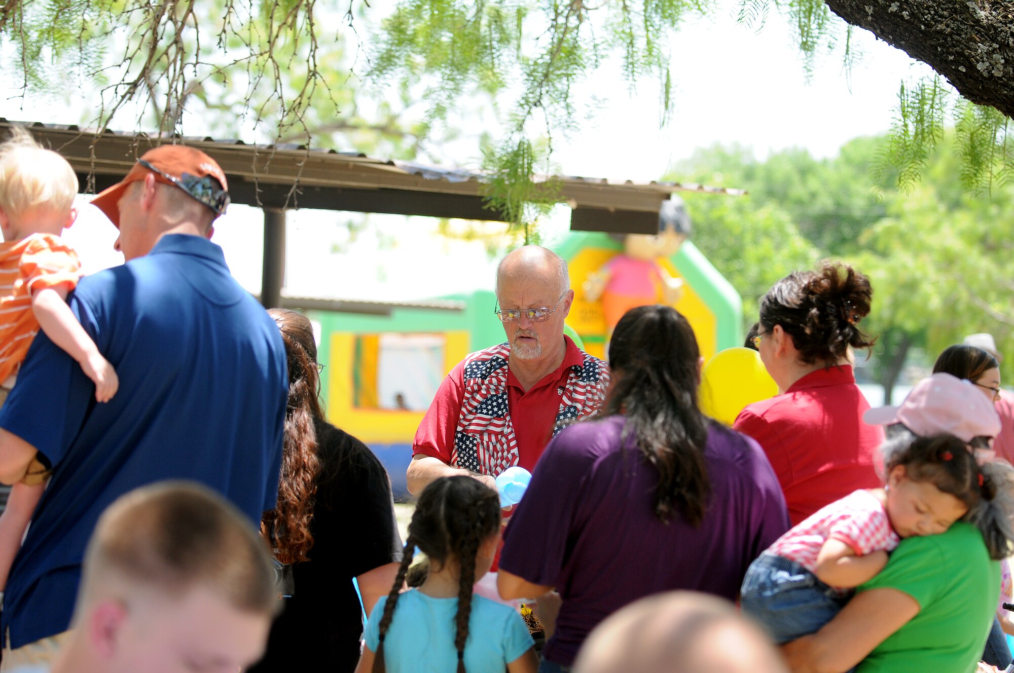 GOODFELLOW AIR FORCE BASE, Texas --The Amazing Mr. K, a local entertainer, creates balloon animals for Team Goodfellow members at Goodfellow's Recreation Camp May 21. The San Angelo community sponsored the 6th annual Goodfellow Appreciation Day and provided food, fun and activities to Team Goodfellow. (U.S. Air Force photo/Staff Sgt. Heather L Rodgers)
