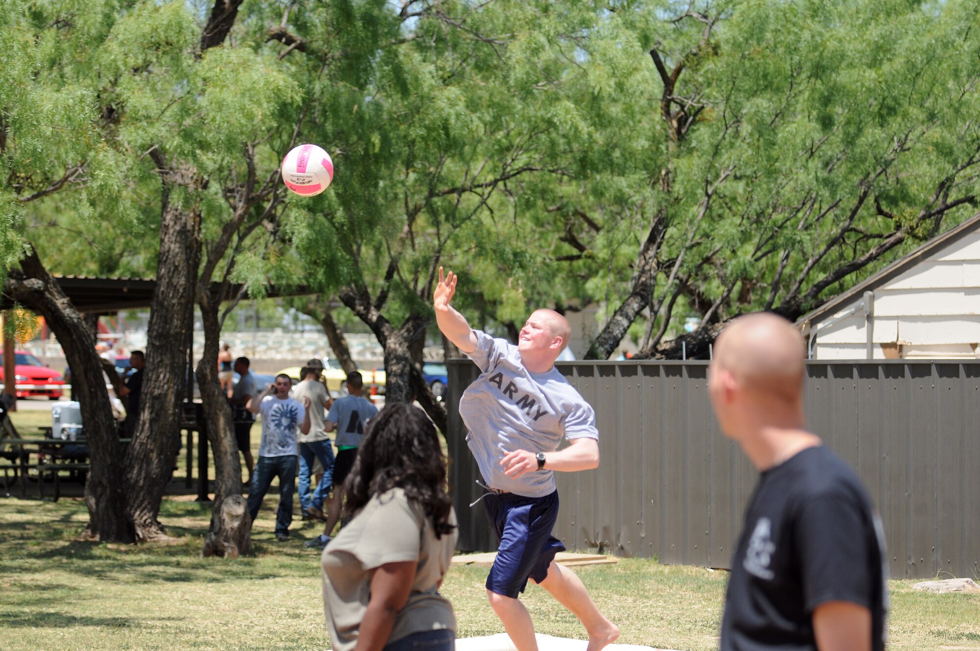 GOODFELLOW AIR FORCE BASE, Texas -- Army Pvt. Jeremiah Henaifesh a 344th Military Intelligence Battalion student, participates in a pickup volleyball game at Goodfellow's Recreation Camp May 21. The San Angelo community sponsored the 6th annual Goodfellow Appreciation Day and provided food, fun and activities to Team Goodfellow. (U.S. Air Force photo/Staff Sgt. Heather L Rodgers)
