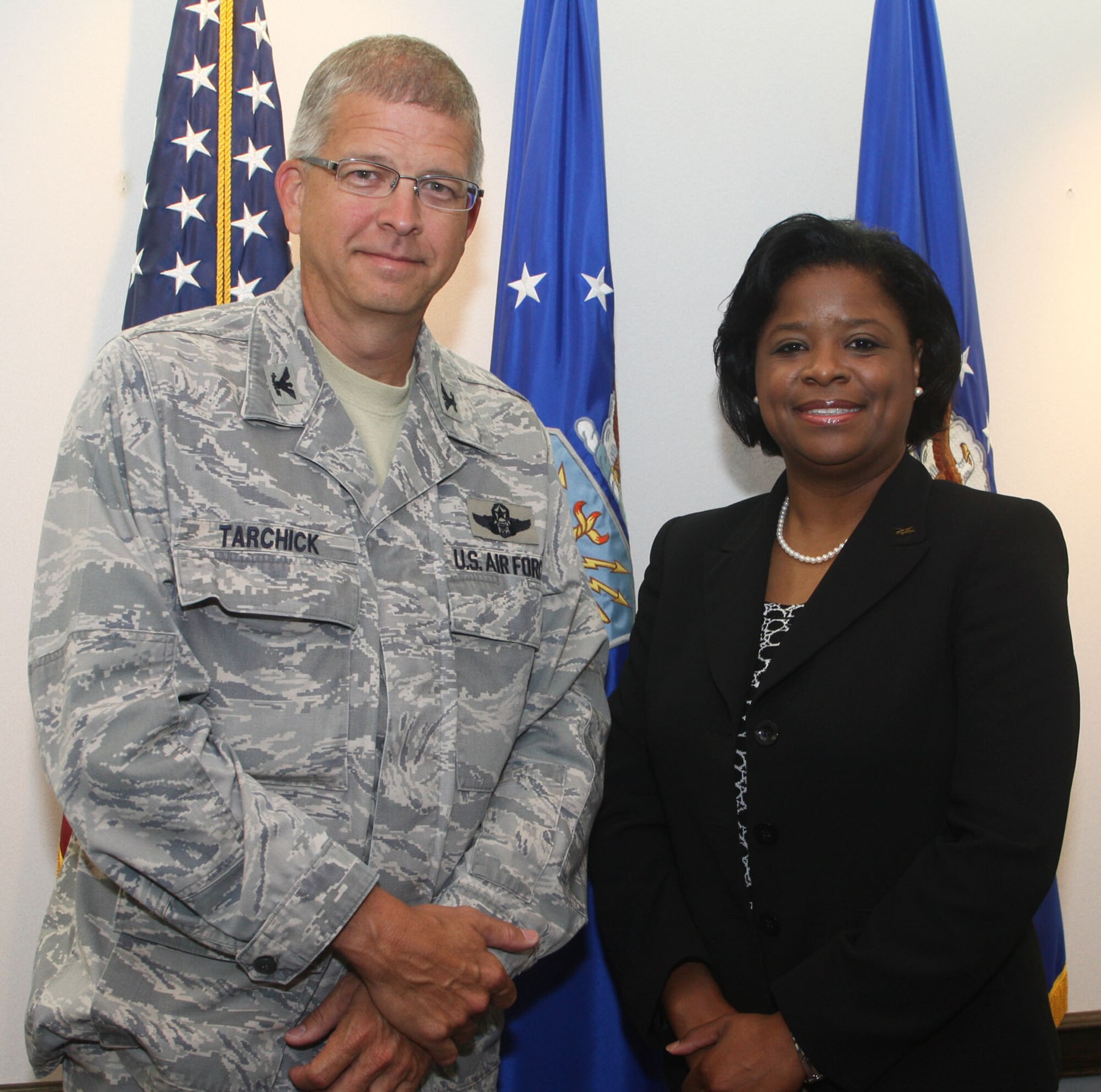 Col. Timothy E. Tarchick, Commander of the 94th Airlift Wing welcomes Shan Cooper, Vice President of Lockheed Martin, Marietta, Ga. facility during her visit here May 24. (U.S. Air Force Photo/Don Peek)