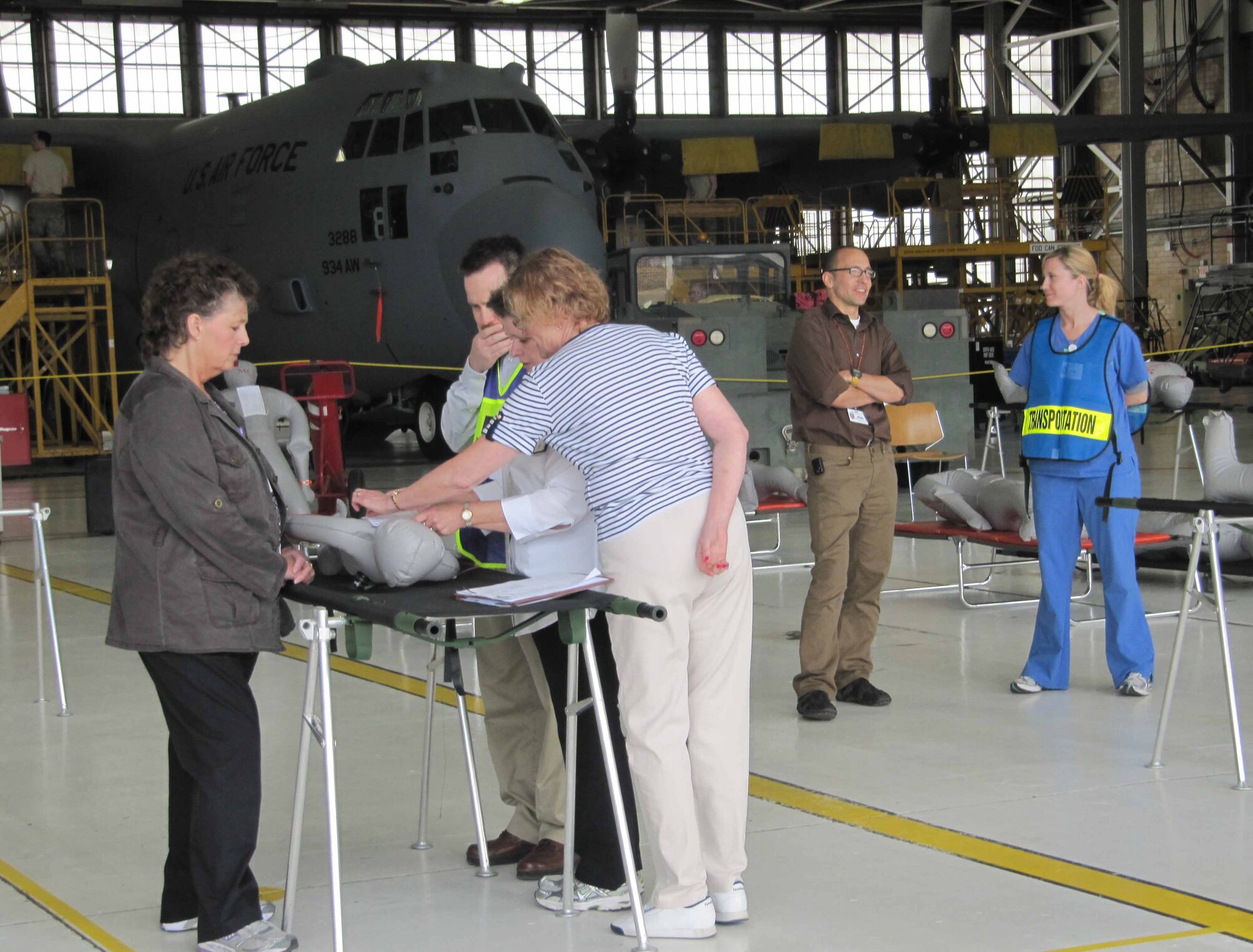 Representatives from local health care and government agencies participate in the patient processing portion of the National Exercise Argent Sentry May 19th at the 934th Airlift Wing. The exercise centered on the scenario of a catastrophic earthquake encompassing eight central states. (Air Force Photo/Lt. Col. C.J. Bentley)