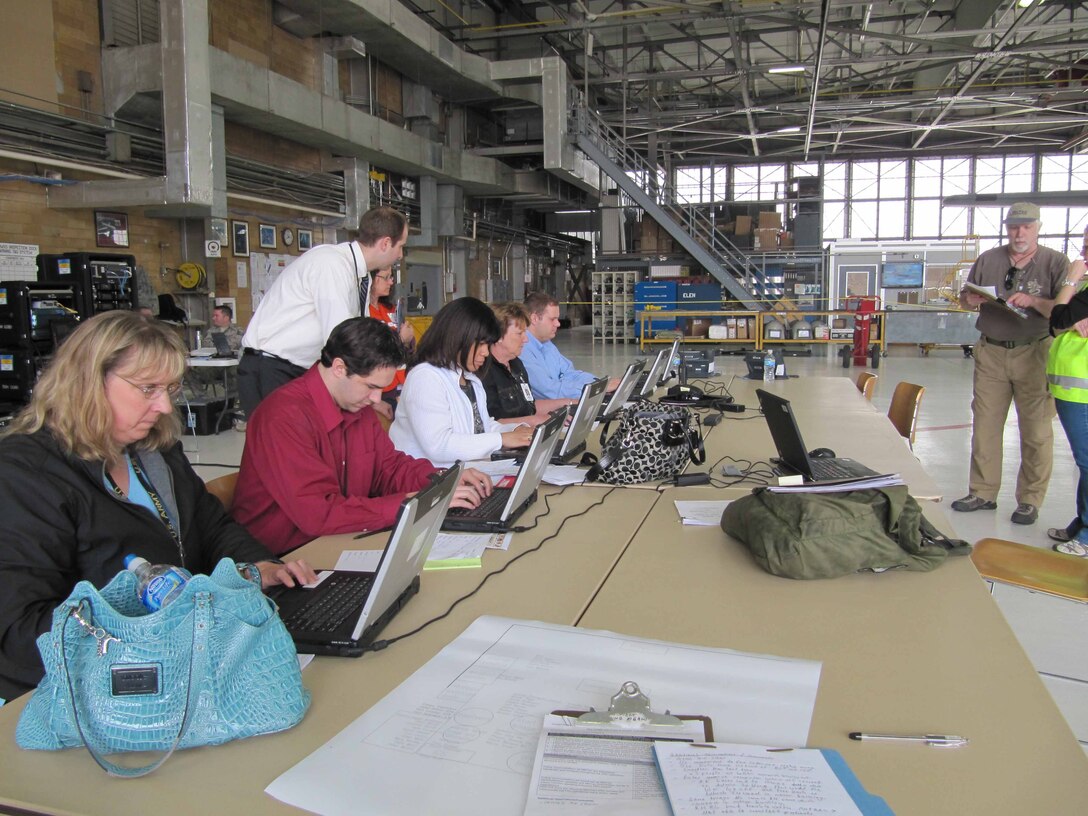 Representatives from local health care and government agencies input patient data during the patient processing portion of the National Exercise Argent Sentry May 19th at the 934th Airlift Wing. The exercise centered on the scenario of a catastrophic earthquake encompassing eight central states. (Air Force Photo/Lt. Col. C.J. Bentley)