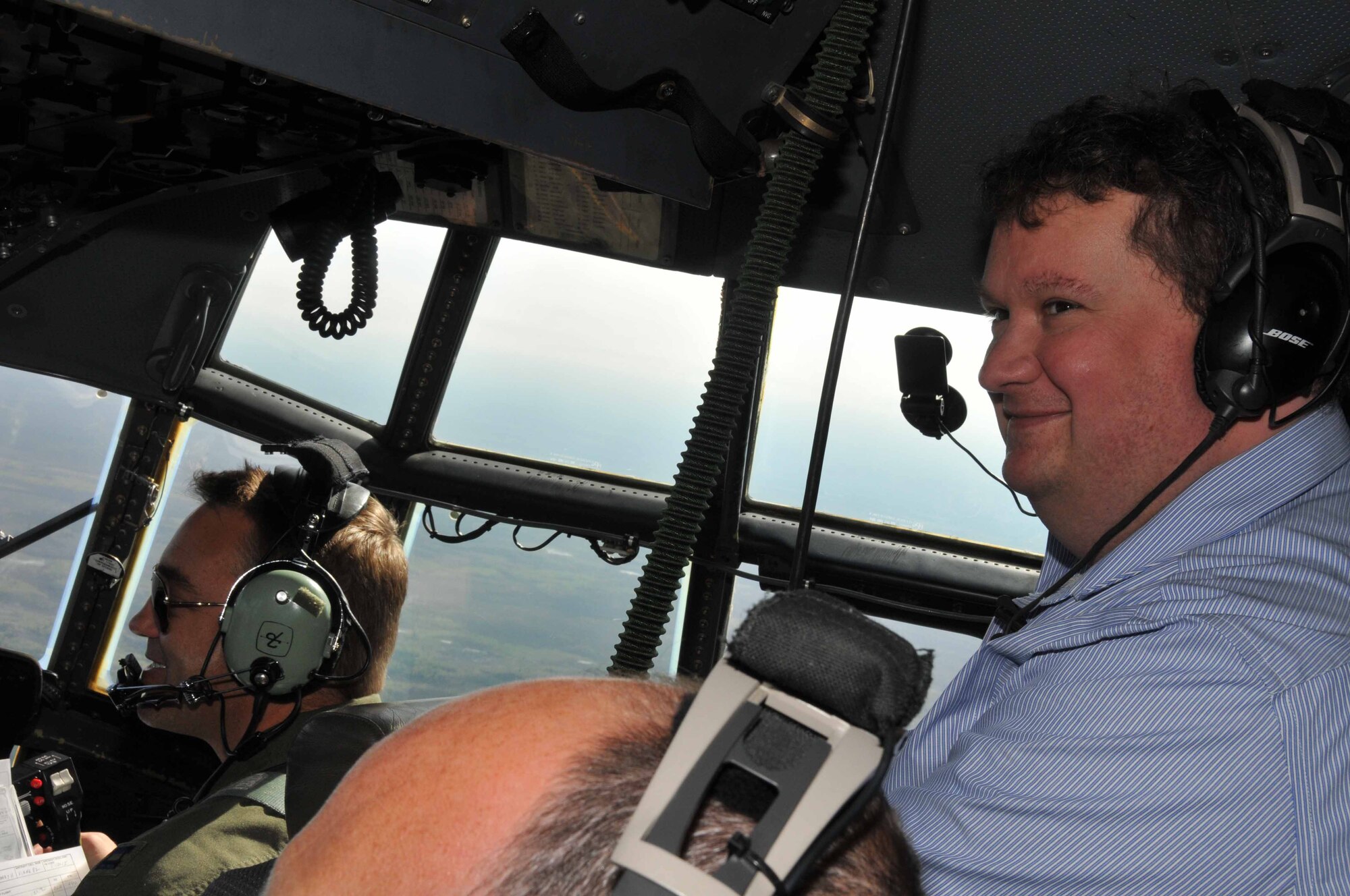 Mike Siebenaler, staffer for Congressman Keith Ellison, enjoys the view from a 934th Airlift Wing C-130 over Duluth during the congressional orientation flight May 19. (Air Force Photo/Paul Zadach)