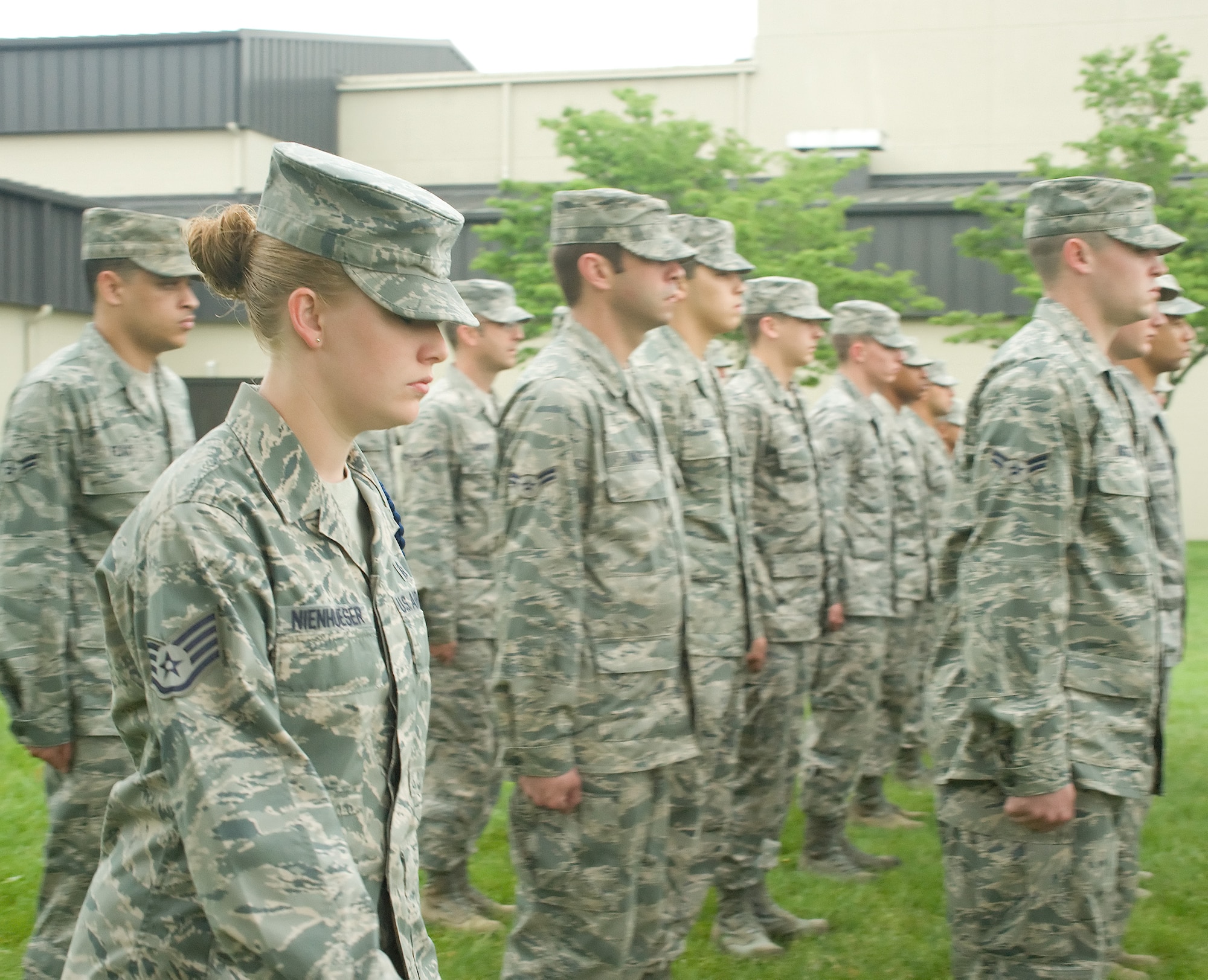 Staff Sgt. Jessica Nienhueser (foreground), 373rd Training Squadron, conducts open-ranks inspection with Detachment 3 Airmen May 24, 2011, at Dover Air Force Base, Del. MTLs lead their Airmen in drill as part of their training experience. (U.S. Air Force photo by Adrian Rowan)

