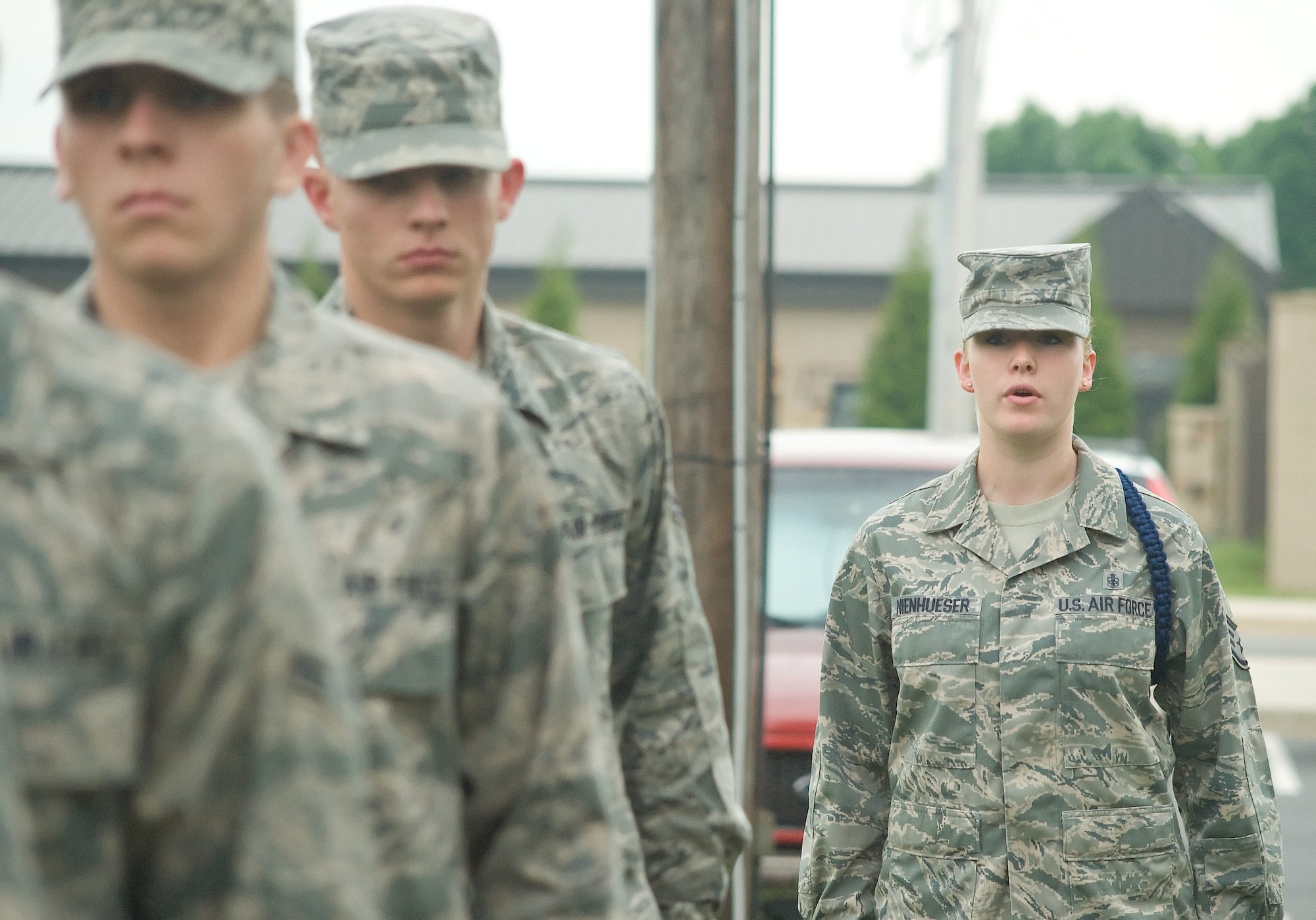 Staff Sgt. Jessica Nienhueser (right), 373rd Training Squadron, issues a marching command to Detachment 3 Airmen May 24, 2011, at Dover Air Force Base, Del. MTLs lead their Airmen in drill as part of their training experience. (U.S. Air Force photo by Adrian Rowan)