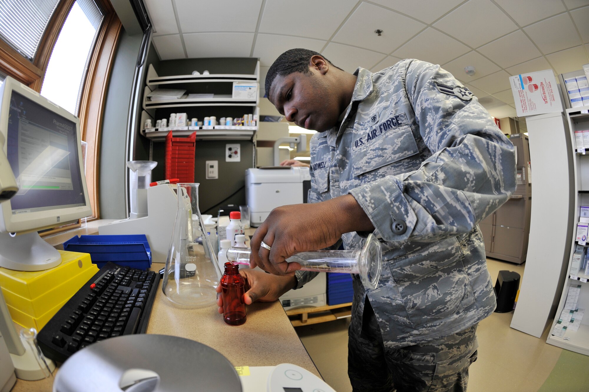 Airman 1st Class Bart Hardwell participates in on-the-job training April 26, 2011, at Fairchild Air Force Base, Wash. Airman Hardwell is a public health technician assigned to the 92nd Aerospace Medicine Squadron. He has been accepted to pharmacy school for fall 2011. (U.S. Air Force photo/Airman 1st Class Mary O'Dell)