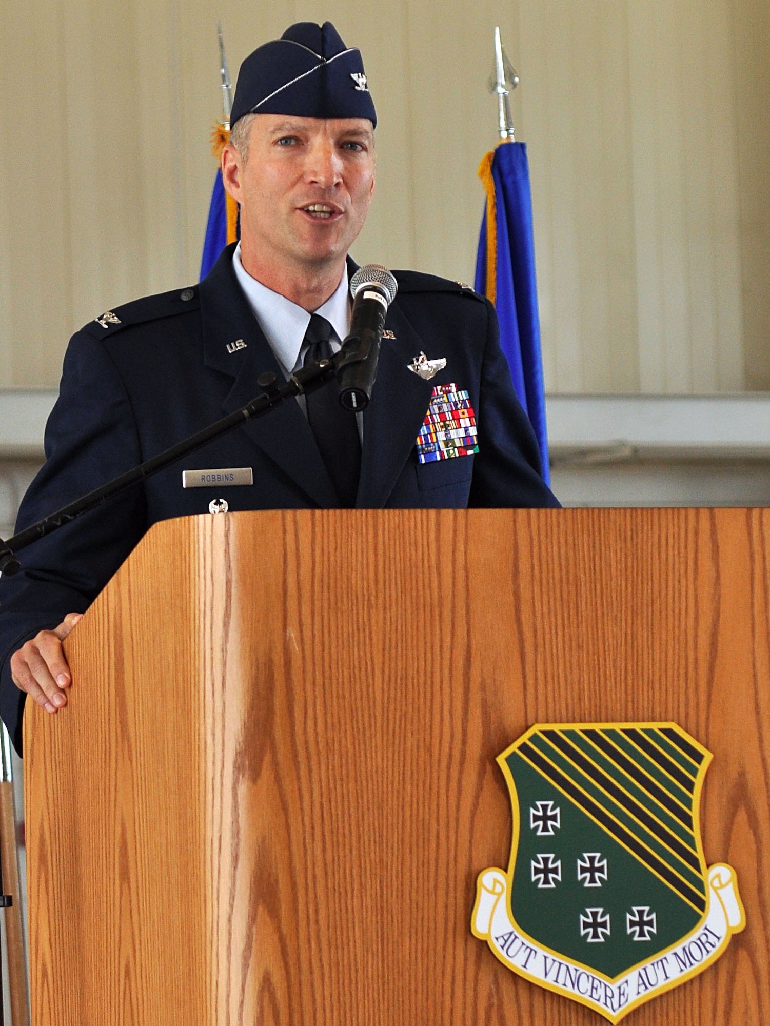 Col. Kevin J. Robbins, 1st Fighter Wing commander, addresses the crowd during the 1 FW change-of-command ceremony at Langley Air Force Base, Va., May 23, 2011. Colonel Robbins assumed command of the wing from Col. Matthew Molloy. (U.S. Air Force photo by Tech. Sgt. Christina M. Styer)(RELEASED) 