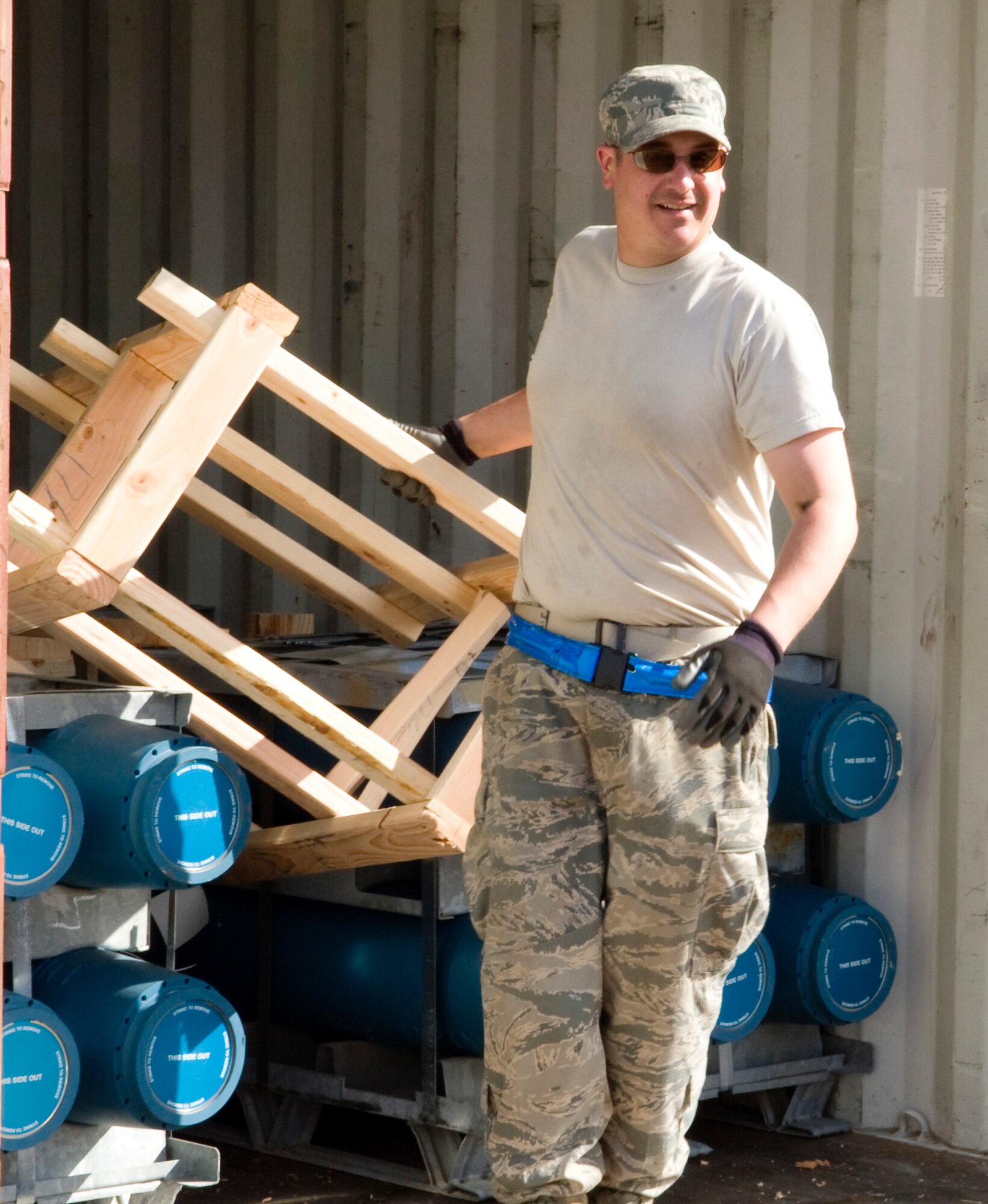 Airman 1st Class Blake Weeden removes a packing crate from inert munitions during the spring barge May 20, 2011, Eielson Air Force Base, Alaska. The 354th Maintenance Squadron munitions flight Airmen prepare the bombs for use by joint and coalition forces to train with during RED FLAG-Alaska, Distant Frontier and Northern Edge exercises. Airman Weeden is assigned to the 354th MXS munitions flight. (U.S. Air Force photo/Airman 1st Class Laura Goodgame) 