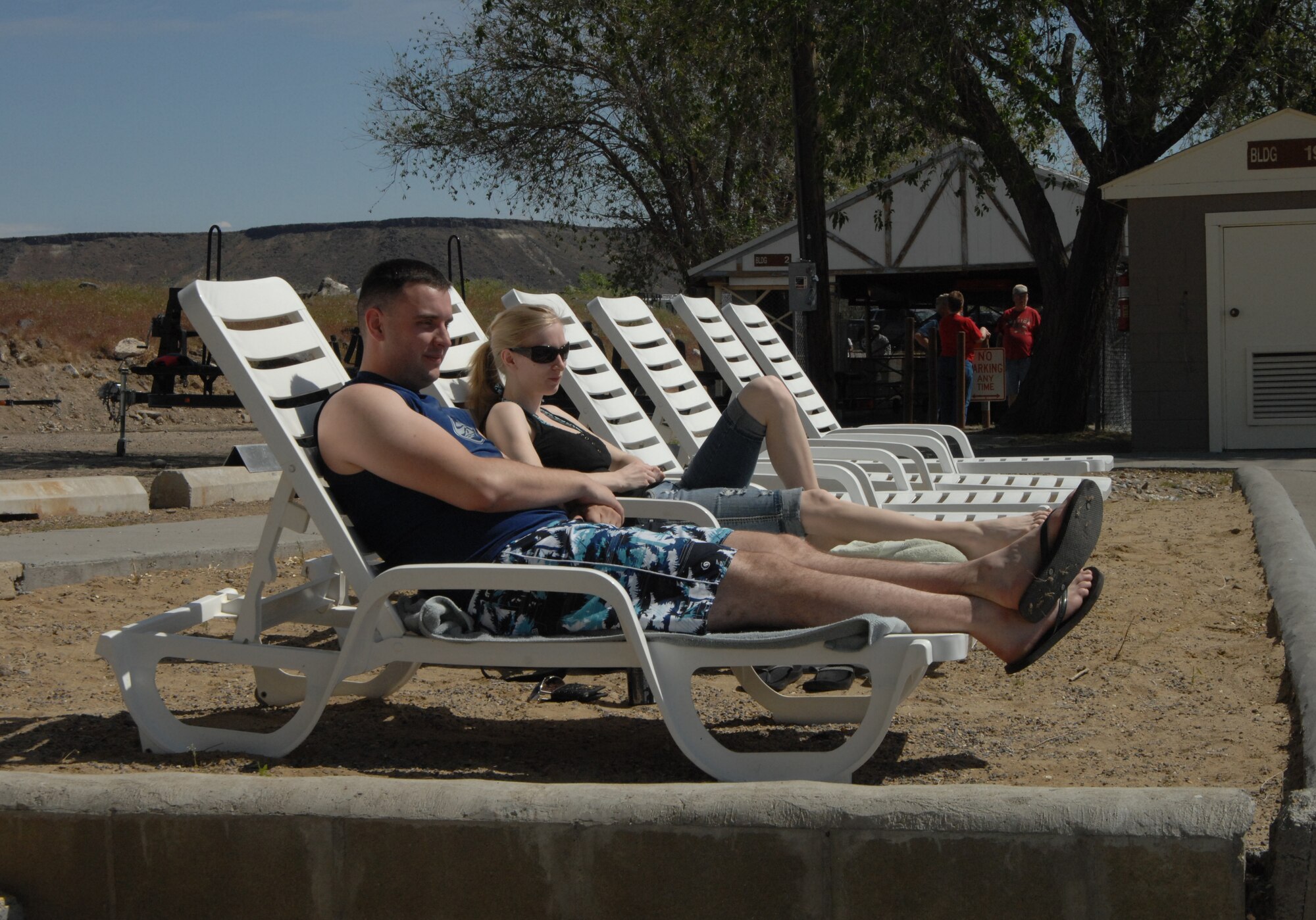 MOUNTAIN HOME AIR FORCE BASE, Idaho – Senior Airman David A. Knapp, 366th Communications Squadron network administrator, and his wife Ashley relax while enjoying the beautiful weather at the Strike Dam Marina’s grand opening May 21. Personnel from the 366th Civil Engineering Squadron rebuilt the main building of the marina as part of a project to help Airmen receive realistic training to prepare them for deployments.  (U.S. Air Force photo by Senior Airman Benjamin Sutton.) 