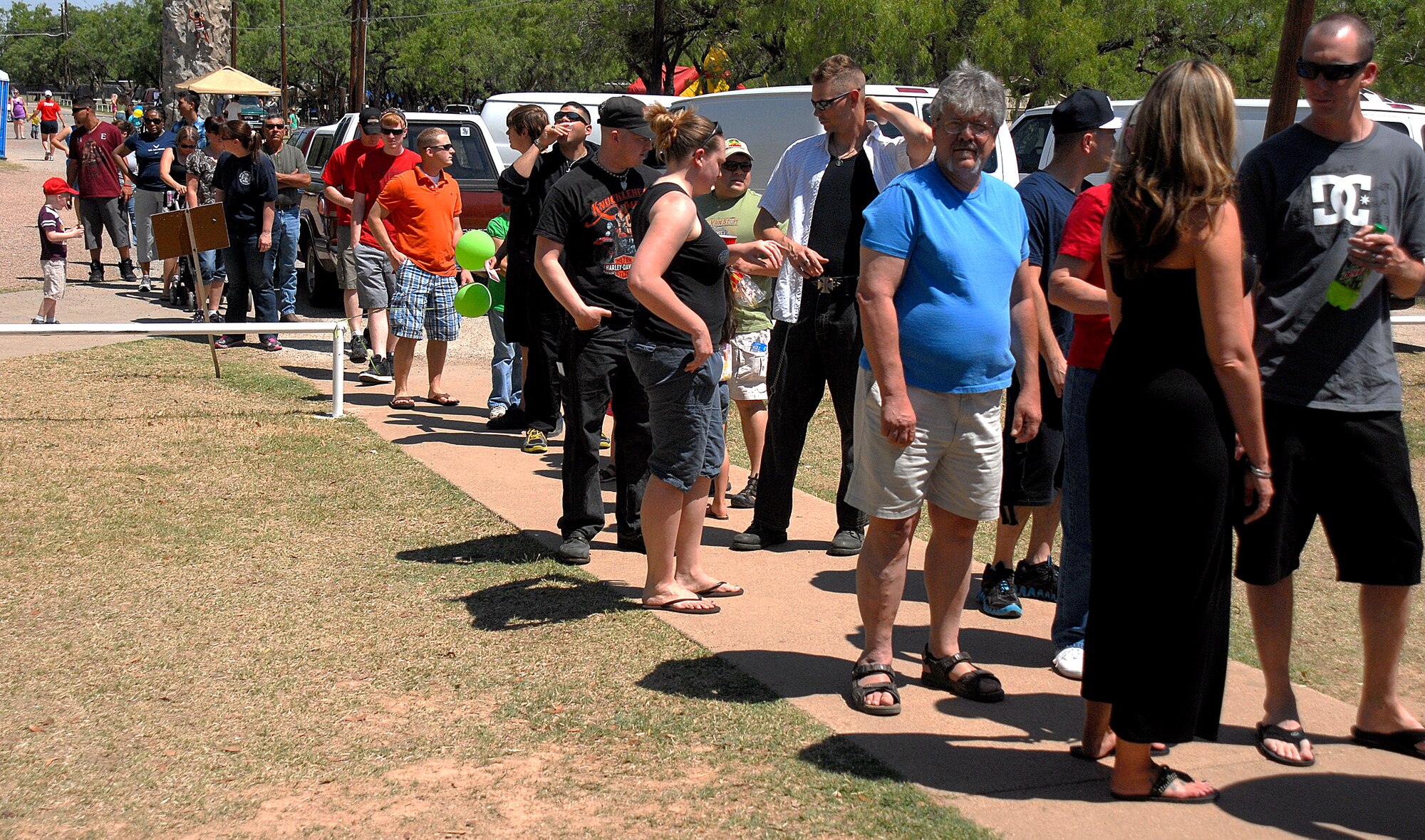 GOODFELLOW AIR FORCE BASE, Texas-- Military servicemembers and families line up to receive food and drinks at the 6th annual Goodfellow Appreciation Day May 23. The event was sponsored by local businesses and included several events, bungee run, rock climbing, snacks and music. (U.S. Air Force photo/Airman 1st Class Michael Smith)