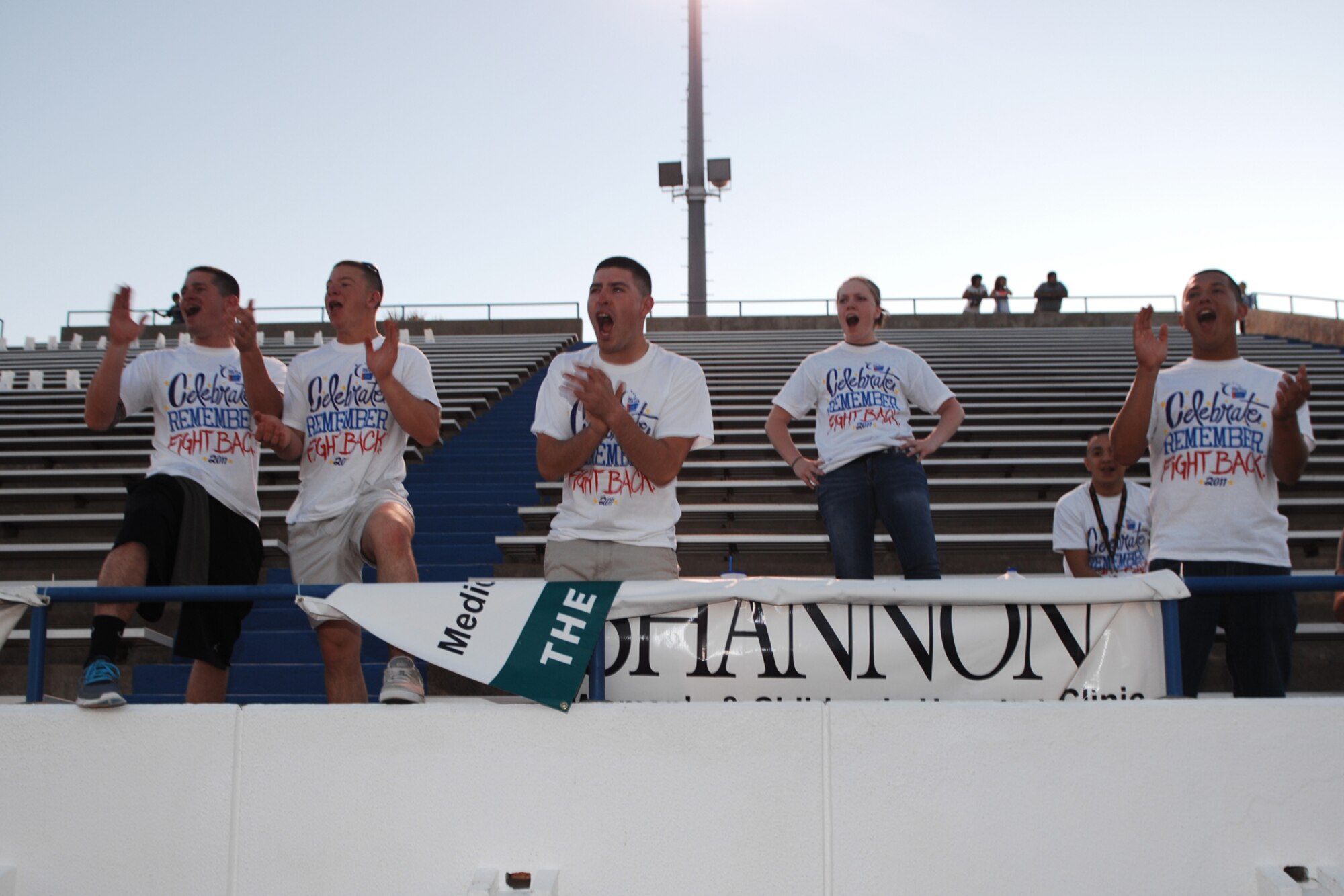 SAN ANGELO, Texas -- Marine Corps students from Goodfellow Air Force Base cheer on participants during the 2011 Relay for Life of Tom Green County Texas May 20. The event raised approximately $190,000 with more than 1300 participants signed up and many more in attendance. (U.S. Air Force photo/Staff Sgt. Laura R. McFarlane)