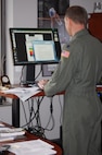 Lt. Col. David Pike, director of operations for the 911th Air Refueling Squadron, was an early-adopter of the elevated work station concept here at the 916th ARW. Colonel Pike started using his new desk in early 2011 to help with his goals in health and fitness. (USAF photo by Maj. Shannon Mann, 916ARW/PA)