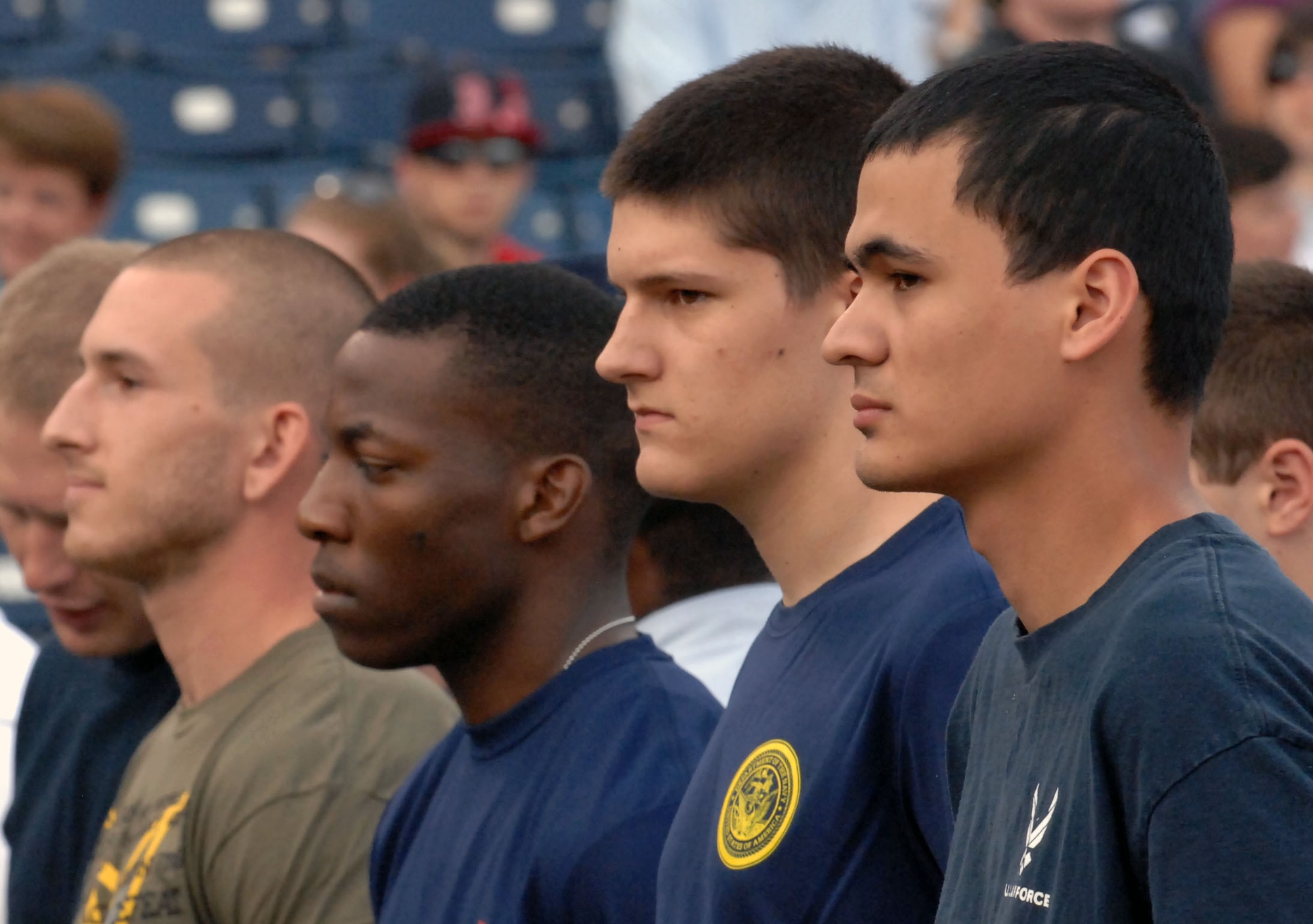 Future recruits prepare to take the Oath of Enlistment during Norfolk Tides' Military Appreciation Night Saturday, May 21, 2011 at Harbor Park Stadium in Norfolk, Va. The Oath of Enlistment was given by Major Gen. Joseph Reynes  Jr., Joint Concept Development and Experimentation director. Approximately 50 recruits took the oath before the start of the game. (U.S. Air Force photo by Staff Sgt. Jeff Nevison)(Released)