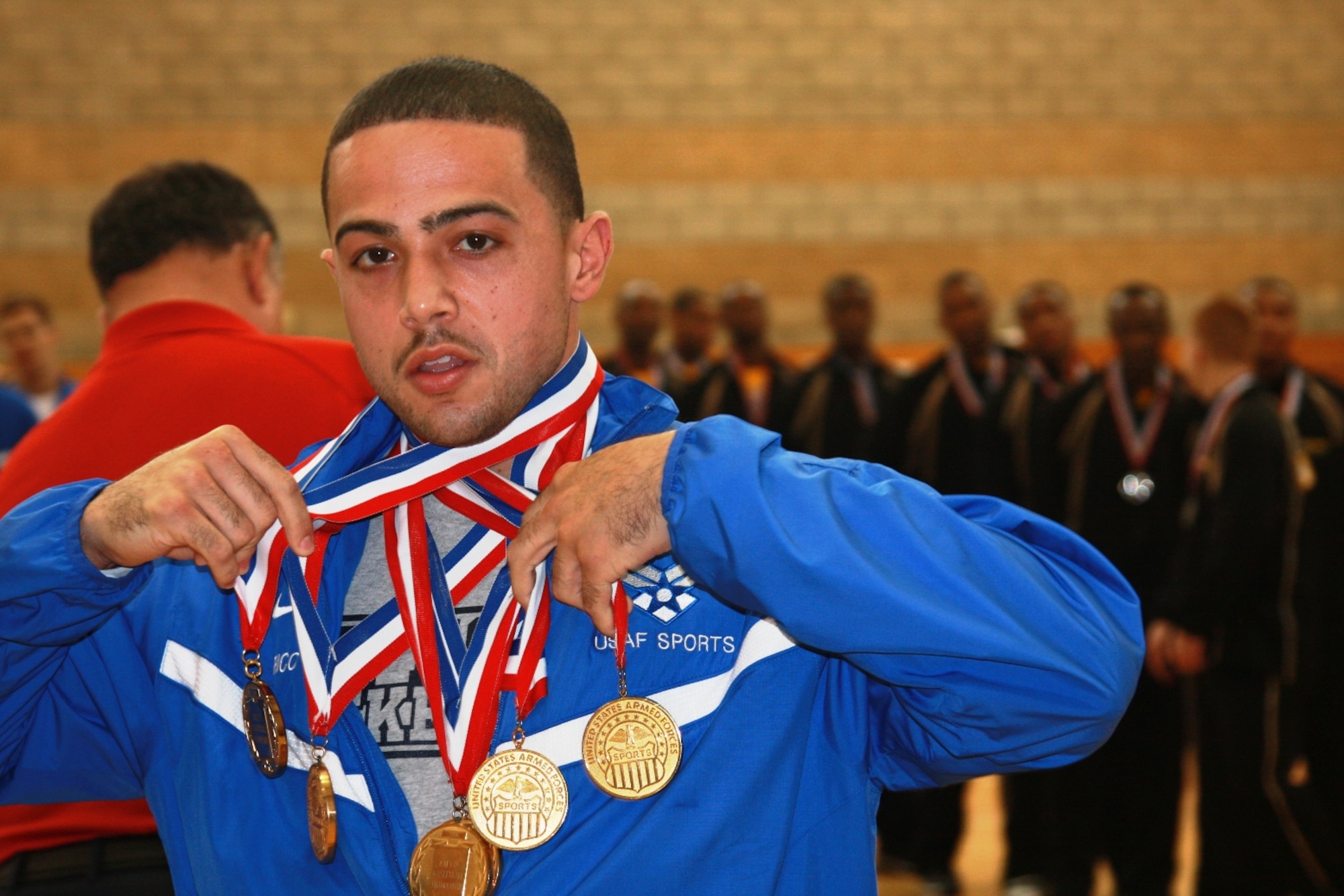 Staff Sgt. Rico Bachelor, Hurlburt Air Field, Fla., displays the six gold medals the Air Force men's basketball team has won consecutively during the annual Armed Forces basketball tournament. Sergeant Bachelor and the men's team won this year's tournament by beating the Army 71-65. (Courtesy photo)