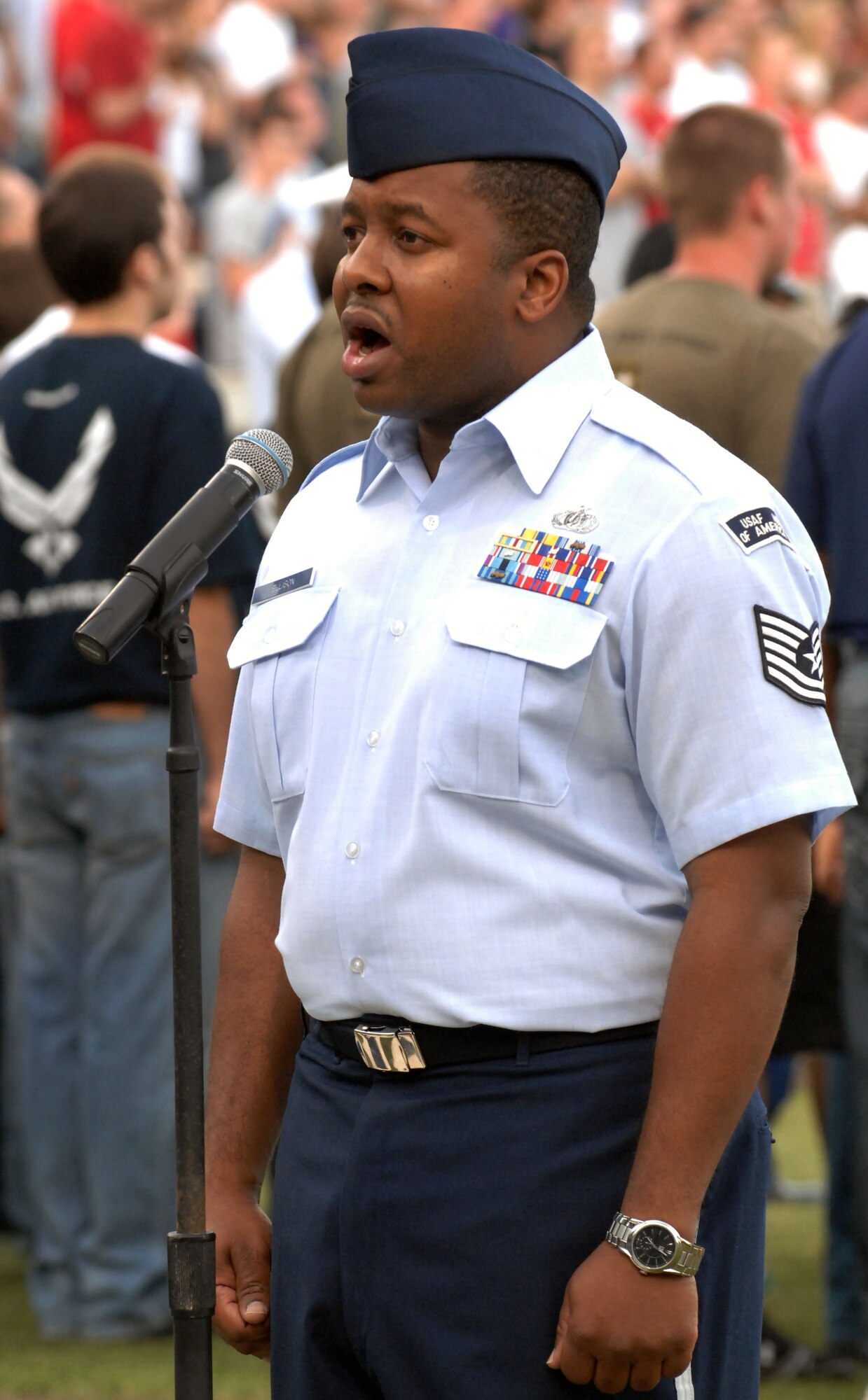 TSgt Ronicle Ellison, United States Air Force Heritage of America Band member, sings the National Anthem during Norfolk Tides' Military Appreciation Night Saturday, May 21, 2011 at Harbor Park Stadium in Norfolk, Va. The event honored military members from the local community in all branches of service. (U.S. Air Force photo by Staff Sgt. Jeff Nevison)(Released)