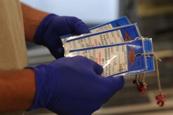 Staff Sgt. Adam Hall examines warning tags during a Home Station Check inspection of a C-17 at Joint Base Charleston - Air Base, May 23. HSC is a three-day inspection performed every 120 days. Sergeant Hall is assigned to the HSC department of the 437th Maintenance Squadron. (U.S. Air Force photo/ Staff Sgt. Nicole Mickle) 

