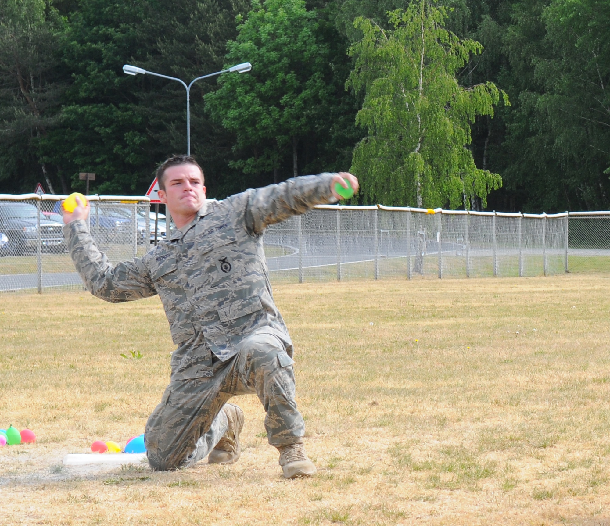 SPANGDAHLEM AIR BASE, Germany – Staff Sgt. Eric Minthorn, 52nd Security Forces Squadron, throws a water balloon at a target during the simulated grenade toss event at the 52nd SFS Decathlon here May 17. The 52nd SFS Decathlon consisted of five teams competing in 10 separate events. (U.S. Air Force photo/Airman 1st Class Dillon Davis)
