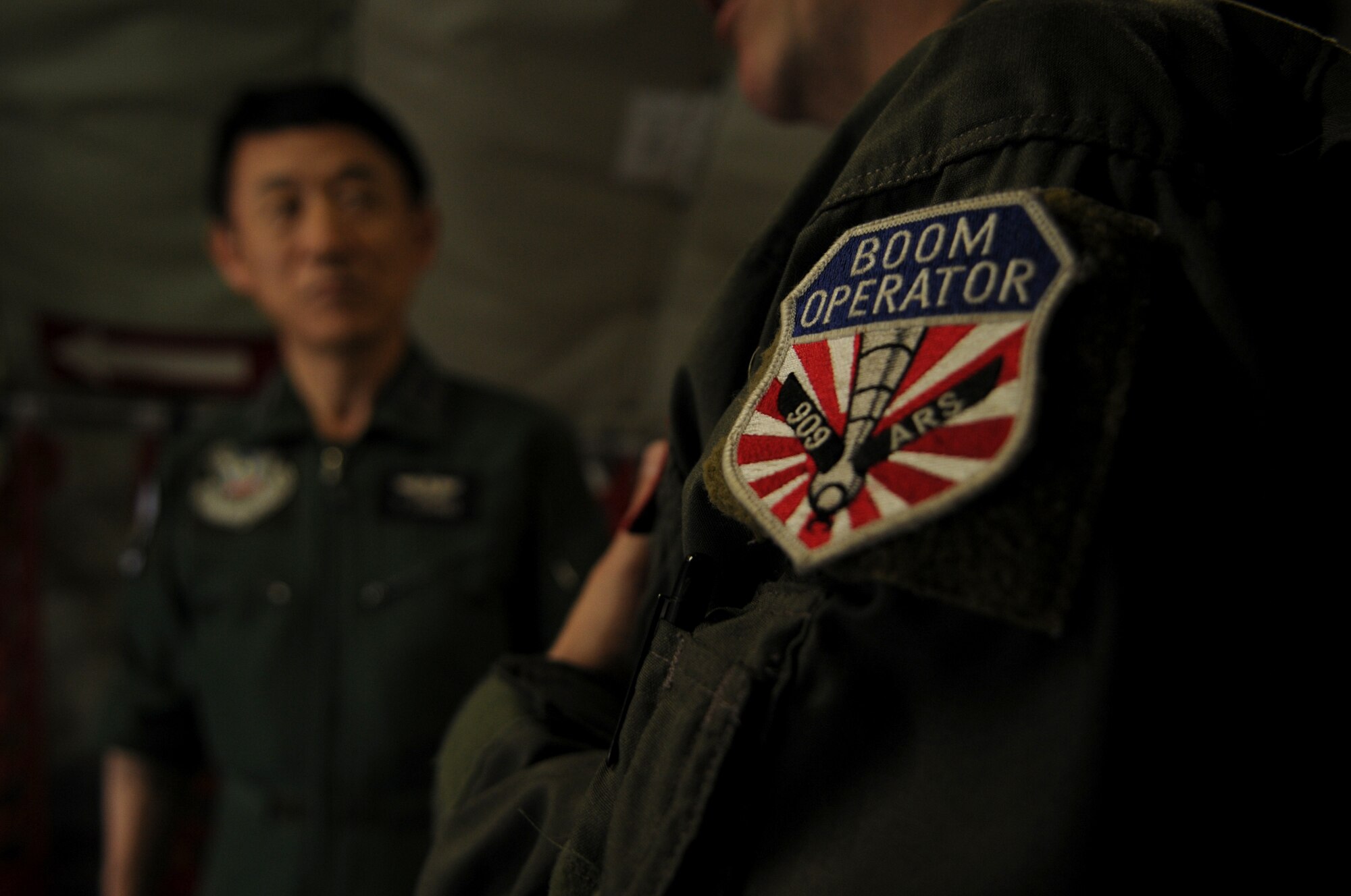 Master Sgt. Mike Webster, an in-flight refueling technician with the 909th Air Refueling Squadron, gives  Lt. Gen. Tsugio Ishino, Central Air Defense Force commander for the Japan Air Self Defense Force, a pre-flight briefing aboard a KC- 135 Stratotanker aircraft at Kadena Air Base, May 24. The orientation flight allowed Lt. Gen. Ishino to observe the F-15J pilots' air refueling training.  This opportunity allowed the general to become familiar with training operations before his aircraft and personnel deploy to Alaska for a joint exercise in June. (U.S. Air Force photo/Airman 1st Class Jarvie Z. Wallace)