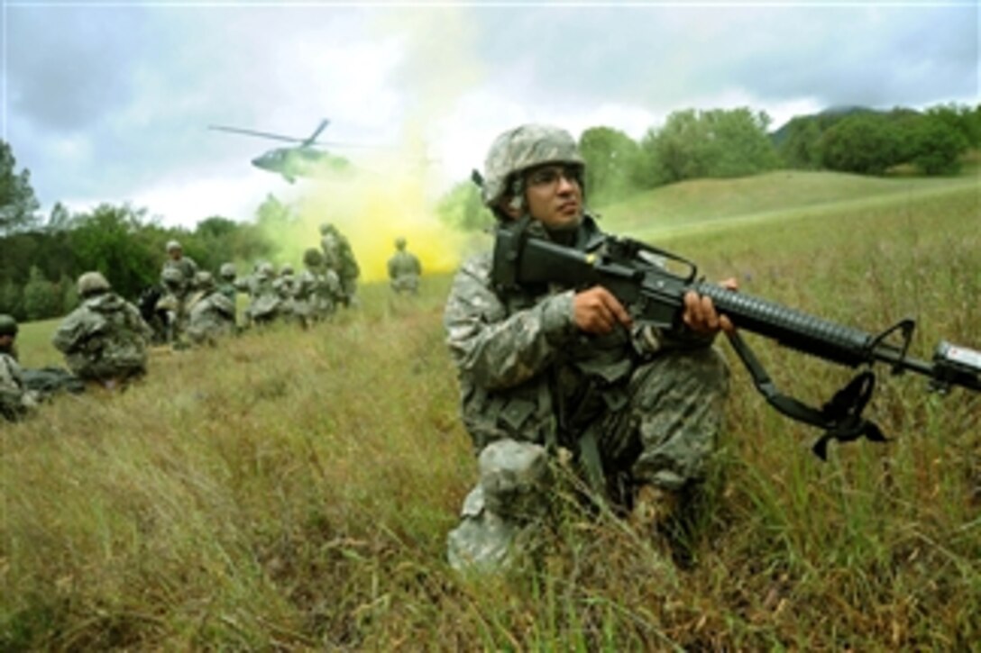 U.S. soldiers and airmen participate in exercises Global Medic 2011 and Warrior 91-11-01 at Fort Hunter Liggett, Calif., on May 17, 2011.  The Warrior exercise gives participating units an opportunity to rehearse military maneuvers and tactics such as security, convoy operations and quick reaction drills during simulated enemy attacks.  Global Medic is a joint field training exercise for theater aeromedical evacuation system and ground medical components.  