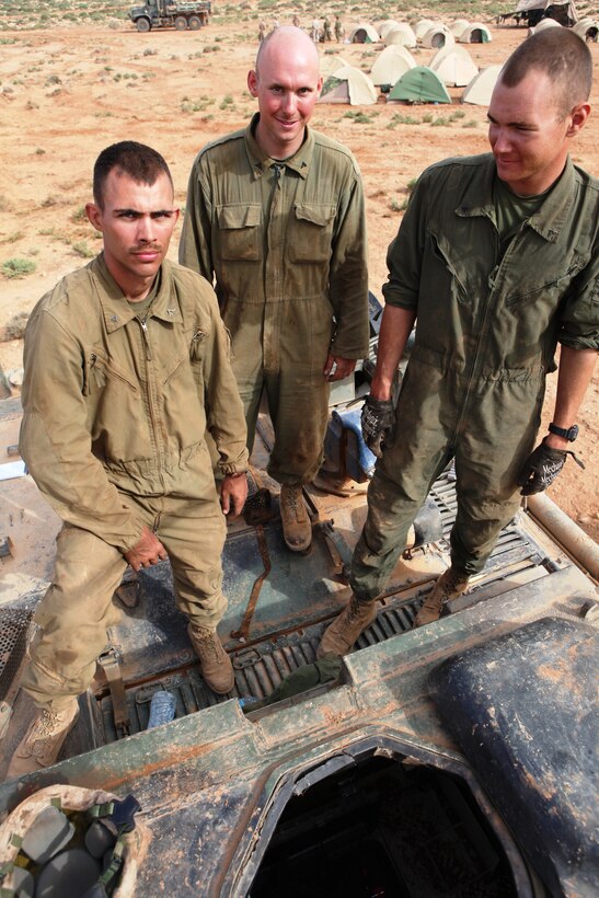 Lance Corporals James Sanders, Paul Poe, and Nicholas Klimek, tank mechanics from Company E, 4th Tank Battalion, stand atop their M88A2 Hercules recovery vehicle May 24 here during Exercise African Lion 2011. African Lion is an annually scheduled, bilateral exercise between the Kingdom of Morocco and the U.S. that involves more than 2,000 U.S. service members and approximately 900 members of the Royal Moroccan Armed Forces.