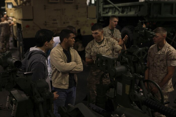 Marines and Sailors with the 24th Marine Expeditionary Unit aboard the USS Iwo Jima (LHD-7) display equipment and demonstrate tactics t Marine Poolies recruited out of Long Island NY. and Boy Scouts from troop 287 out of Green Coslie PA. as they travel to participate in New York City's Fleet Week. Various units from II Marine Expeditionary Force and Marines Forces Reserve have organized under the 24th MEU to form the Special Purpose Marine Air Ground Task Force - New York. The Marines are embarking on the Navy’s Amphibious Assault Ships, the USS Iwo Jima (LHD -7) and USS New York (LPD-21) to take part in New York City's Fleet Week from May 25 to June 1, 2011. There, the Marines will showcase the capabilities of the MAGTF, and also honor those who have served by participating in a various of events during the Memorial Day weekend.