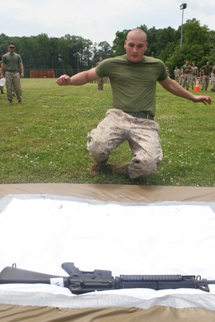 Lance Cpl Jacob Detty, armorer, Headquarters and Support Company, Chemical Biological Incident Response Force races to assemble and disassemble an M16 – A4 service rifle in the rifle relay race during CBIRF’s battalion field meet 24 May. Headquarters and Support Company, IRF A and IFR B all competed against one another in several events to strengthen unit cohesion and earn bragging rights after the safety brief before the Memorial Day weekend.