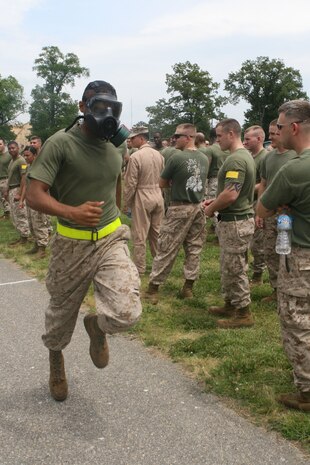 Private First Class Jonathon D. James, Motor Transportation Operator, Headquarters and Support Company, Chemical Biological Incident Response Force races to the finish line in the gas mask relay race during CBIRF’s battalion field meet 24 May. Headquarters and Support Company, IRF A and IFR B all competed against one another in several events to strengthen unit cohesion and win bragging rights after the safety brief before the Memorial Day weekend.