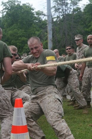 Sgt. Jonathan Muff, Initial Response Force A Team Leader, Decontamination Platoon, Chemical Biological Incident Response Force, leads IRF A’s team in a tug of war match against IRF B during CBIRF’s battalion field meet 24 May. Headquarters and Support Company, IRF A and IFR B all competed against one another in several events to strengthen unit cohesion after the safety brief before the Memorial Day weekend.