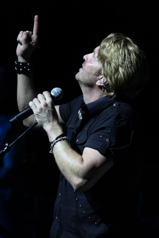 Bill Gentry sings a hymn he dedicated to his father during the 2011 WRNS Military Appreciation Concert that featured Heidi Newfield and him at the air station theater May 25.